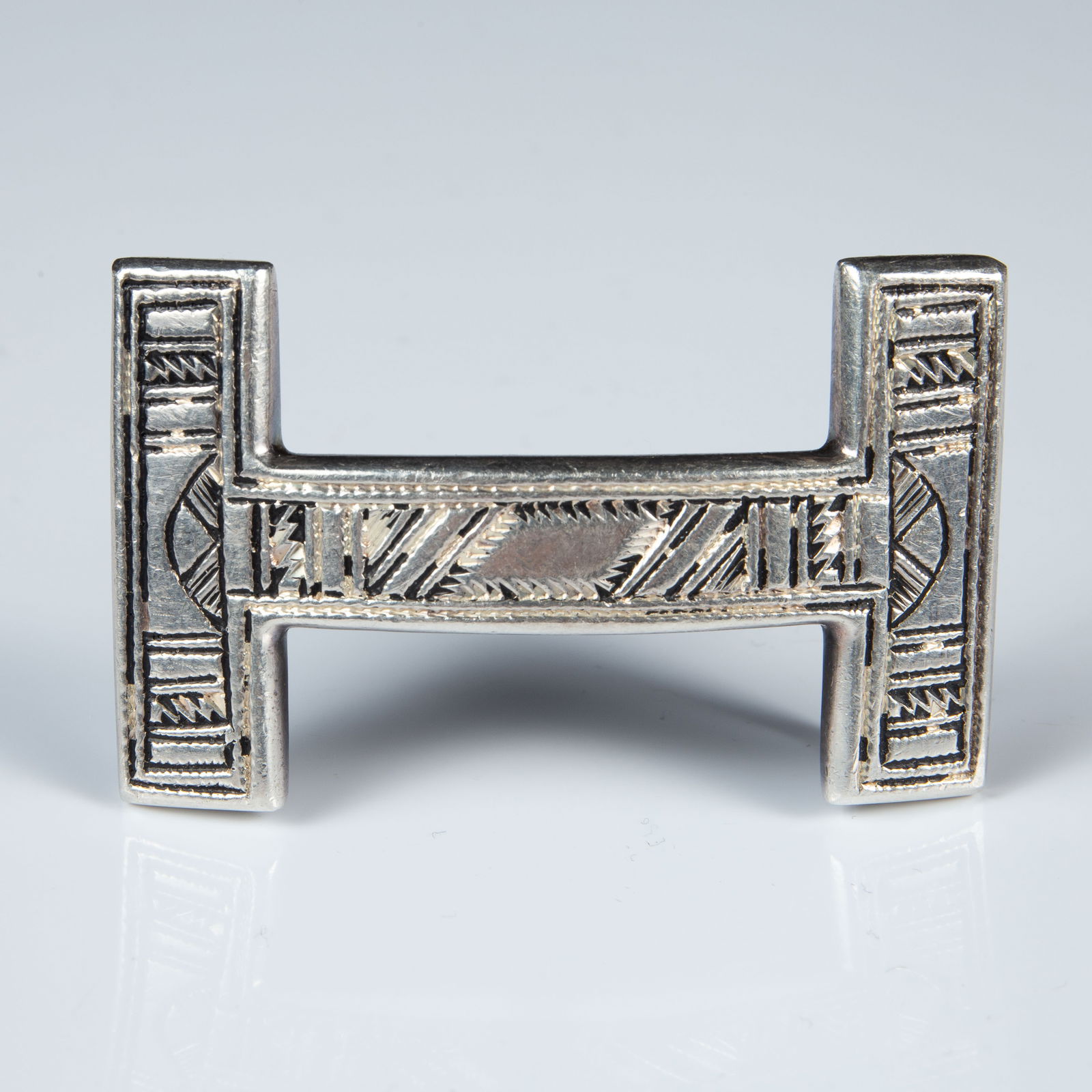 Hermes Quizz Touareg Sterling Silver Belt Buckle.: The Southwest style sterling and enamel belt buckle is marked Ag925, along with several other marks on the back. It is also branded Hermes along a side edge. It measures 2 3/8" x 1 7/8". It weighs