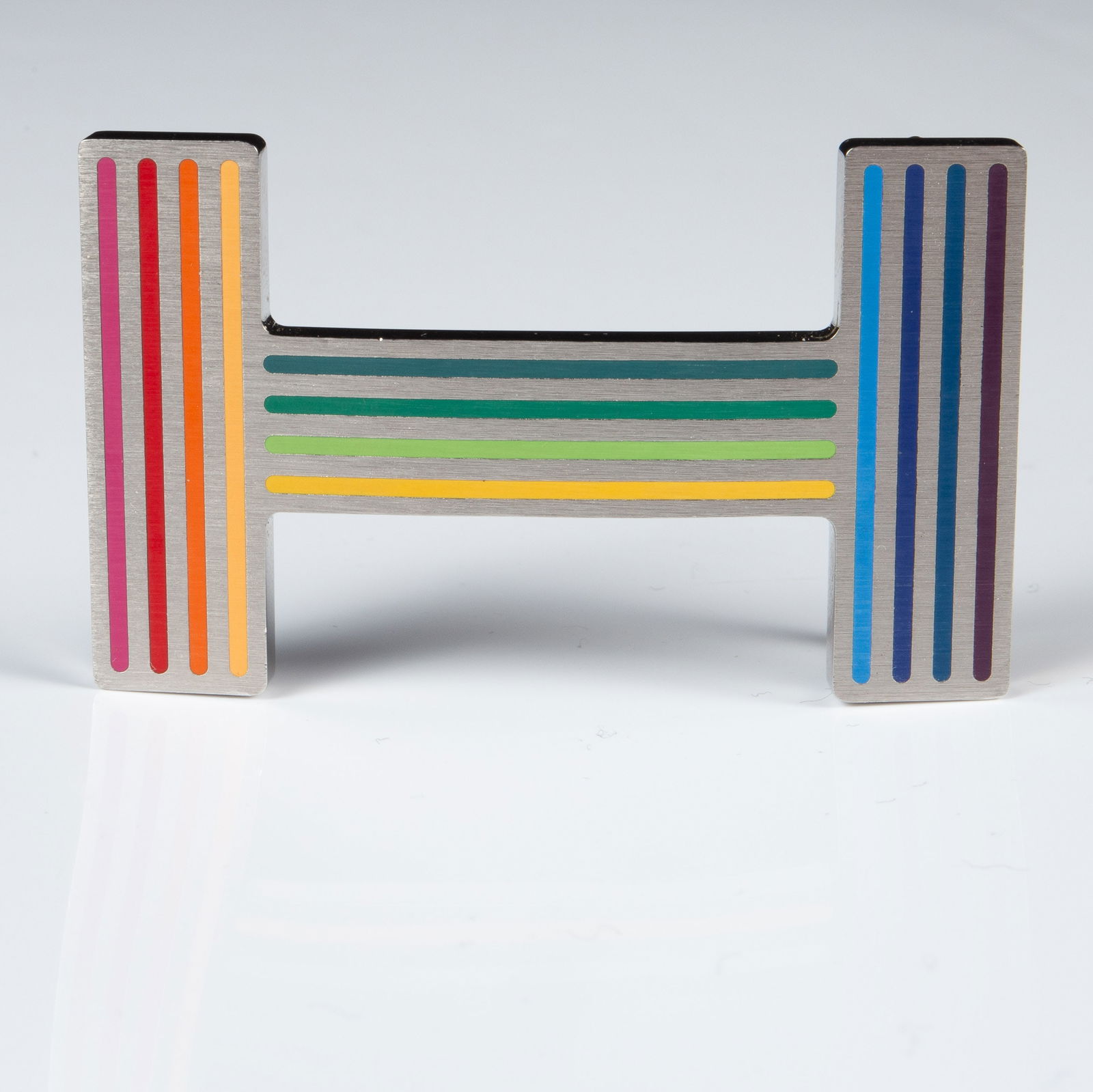 Hermes Quizz Rainbow Belt Buckle.: The piece is marked Made in France ST 02 81 on the back, and Hermes on the top edge. It measures 2 7/16" x 1 7/16". There are a few nicks on the piece. Otherwise, it is in overall good condition.