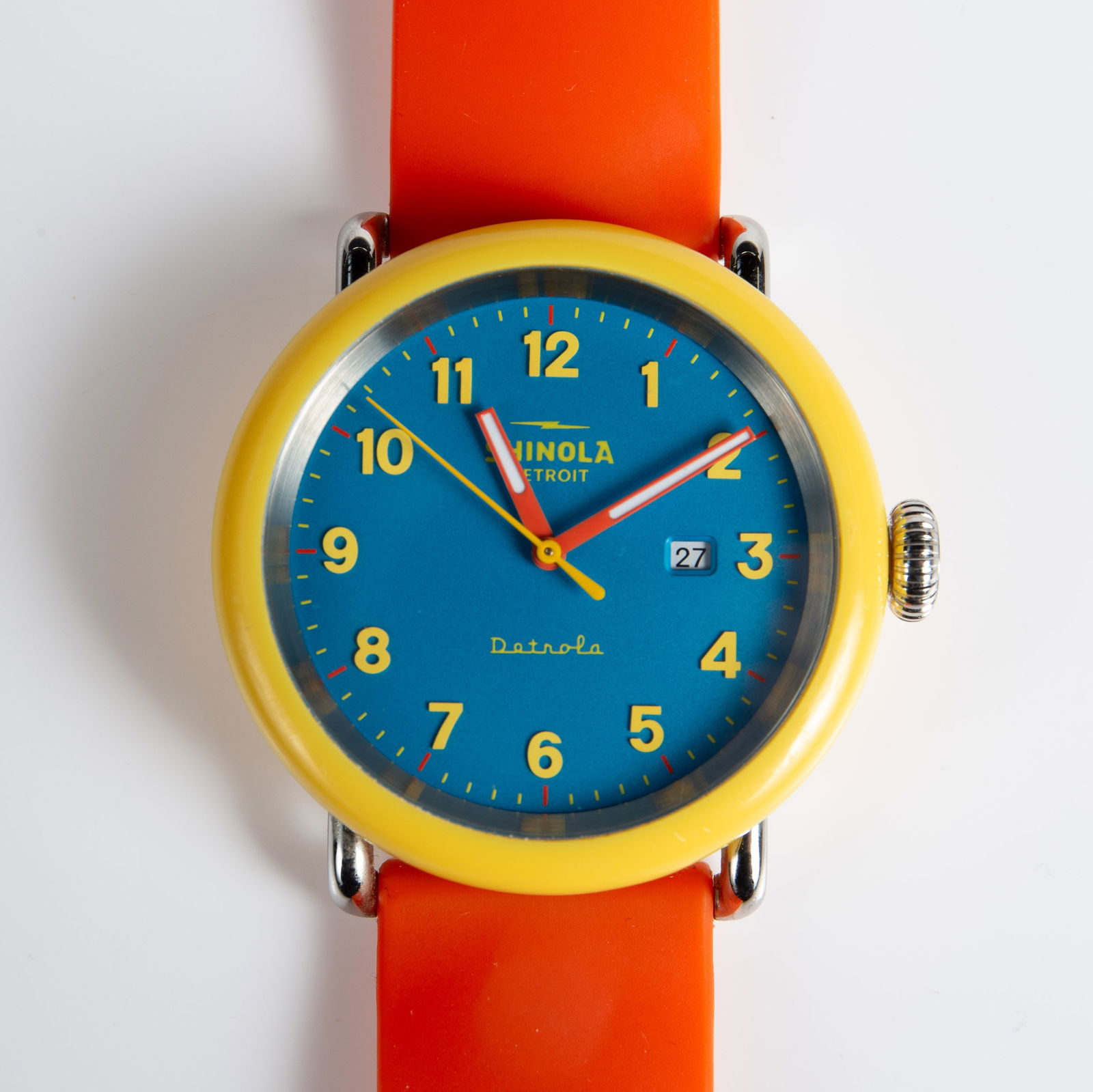 Shinola Detrola Polychrome Quartz Date Watch.: The watch has a yellow case, a sky blue dial, and an orange silicone band. The case measures 43mm in diameter. It likely needs a new battery. It is in very good cosmetic condition. In-house shipping i