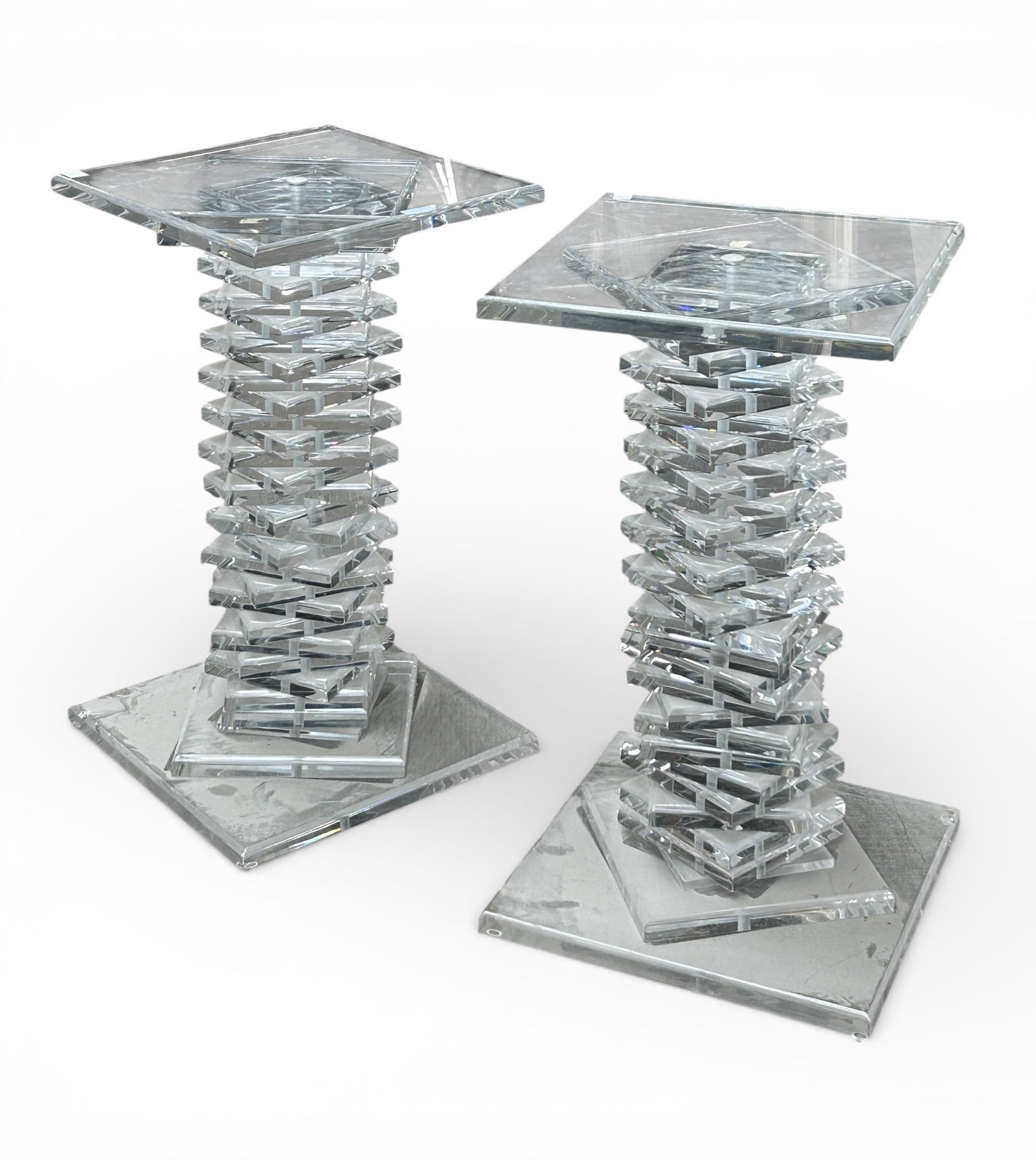 Pair of Spiral Stacked Lucite Pedestals / Stands.: These lucite pedestals are in good overall condition. The tops have some light scratches and sticker residue. Both could use a thorough dusting. Each one measures 17" wide, 17" deep, and 29 1/2"