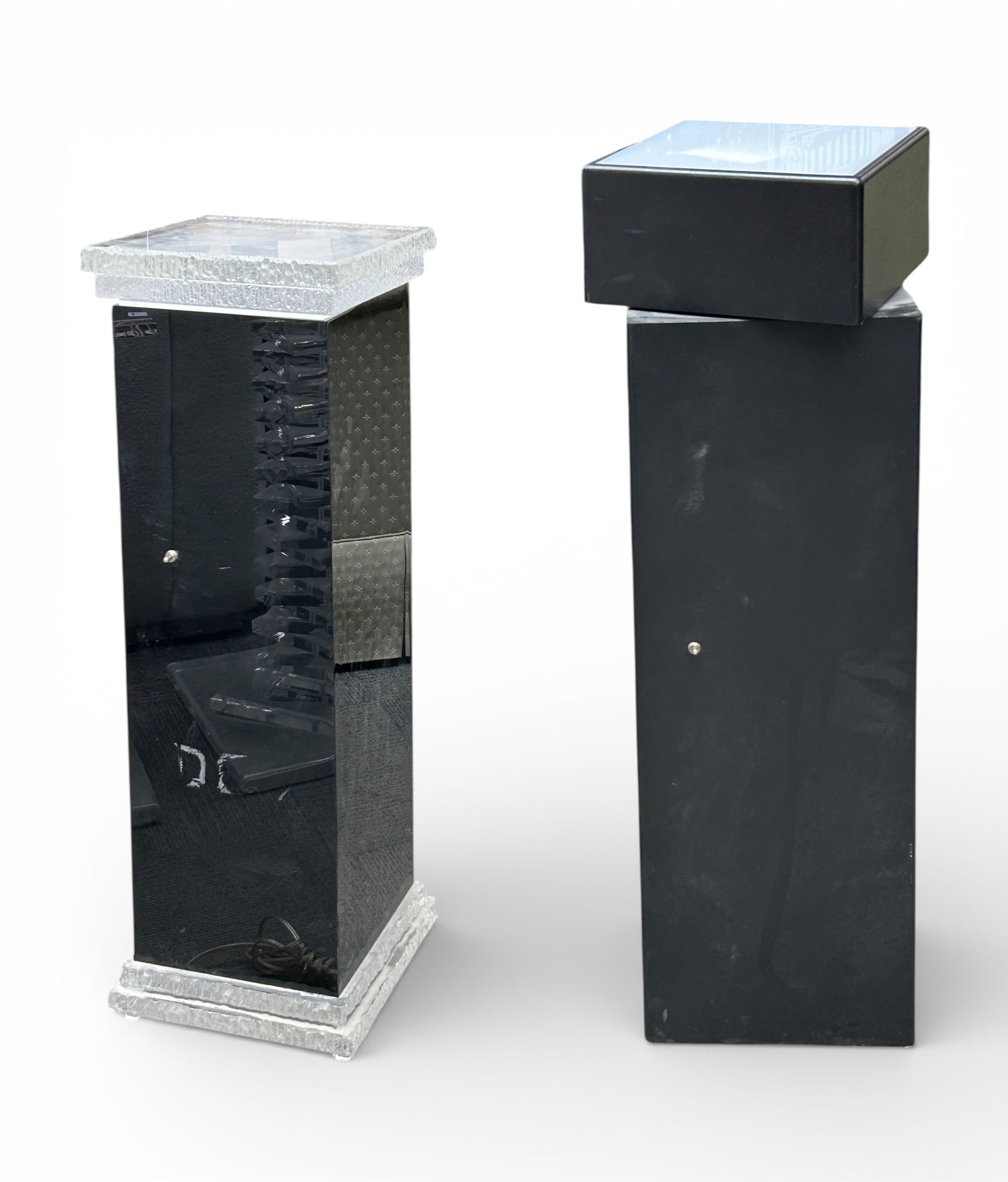 Two Illuminated Display Stands.: The shorter stand has a ridgid lucite base and a removable lucite top. It measures 12" wide, 12" deep, and 36" tall. The taller stand has a rotating top. It measures 12" wide, 12" deep, and 40 1/2"