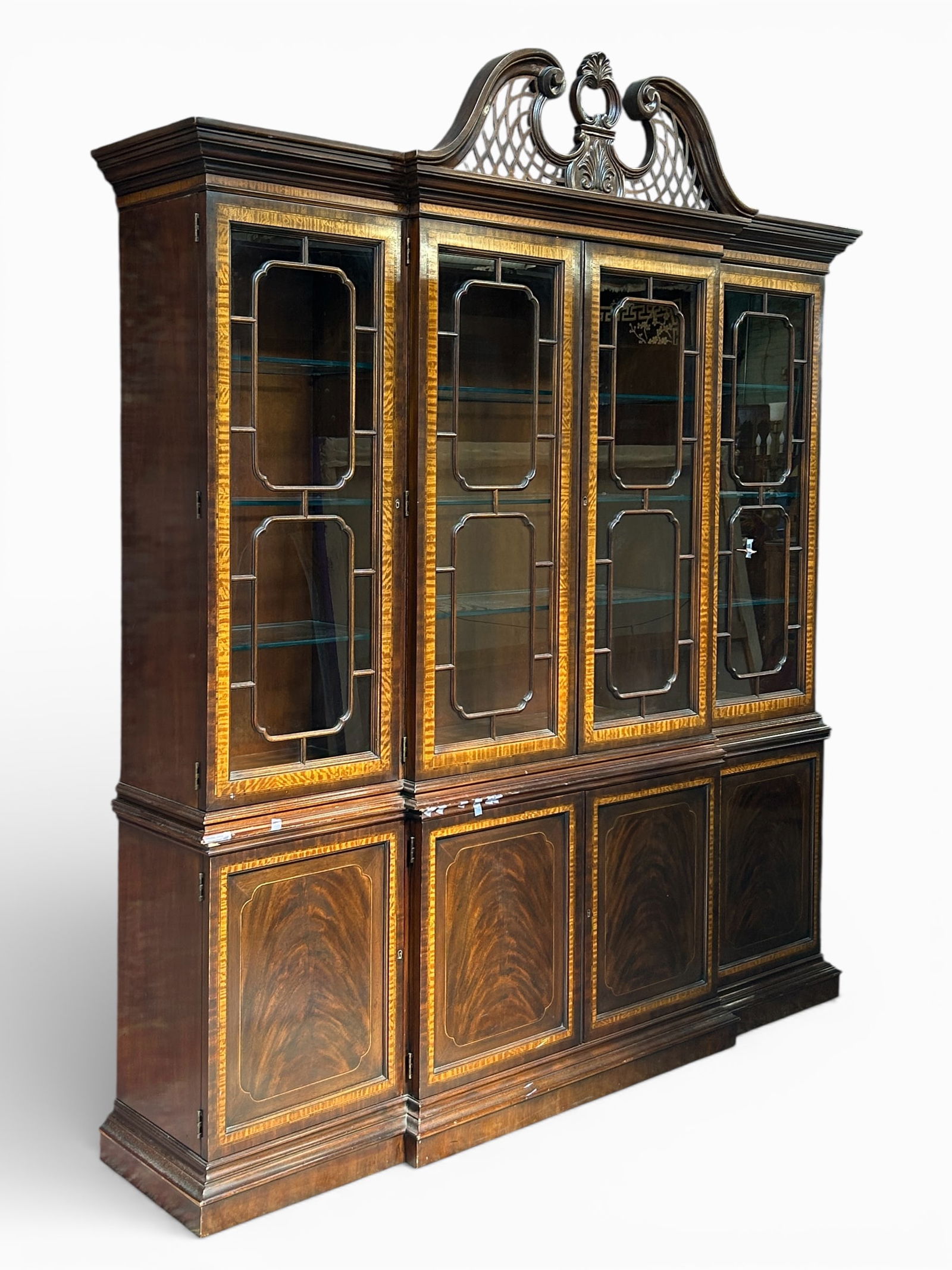 Drexel Heritage Mahogany Breakfront.: This china cabinet, display case, or bookcase is beautifully banded and inlaid. It has an upper section with four fretwork doors and nine shelves. The bottom section has four doors with a central