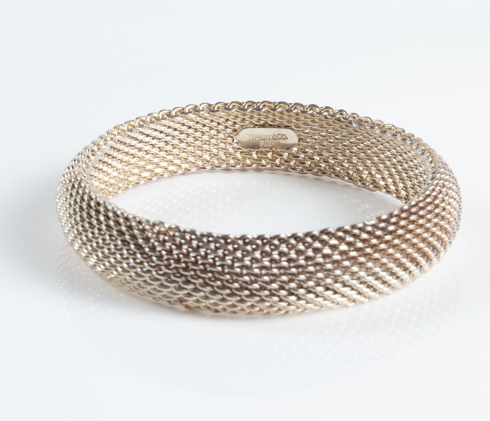 Tiffany & Co. Sterling Mesh Somerset Bracelet.: The bracelet is marked Tiffany & Co. 925 on a tiny plaque inside the piece. The bracelet measures 2 1/2" across the inside and 9/16" wide. There are some scratches and stains on the piece. Otherwise,