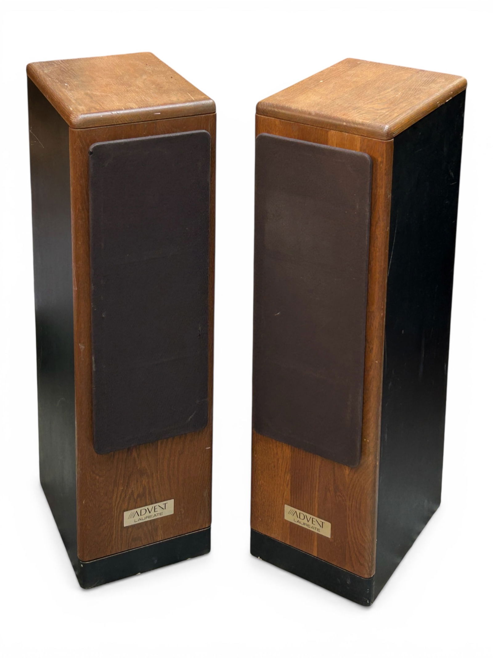 Pair of Advent Laureate Narrow Loud Speakers.: The pair of vintage speakers measure 32 3/4" tall, 9 1/8" wide, and 12" deep. There are some scratches and stains on the pair, and a few tears on the grills or covers. Otherwise, the lot is in