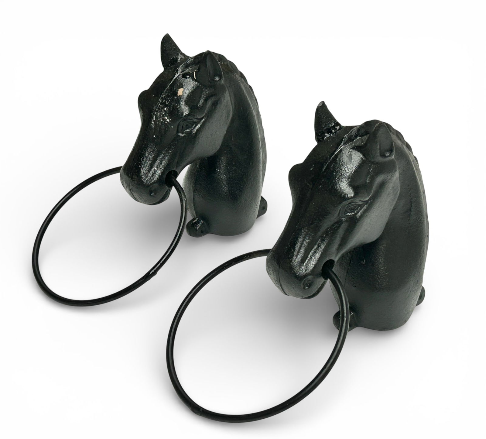 Cast Iron Hitching Post Horse Head Tops.: The black cast iron post caps measure 10 1/2" tall, 6 1/4" wide, and 7 1/4" deep. There are a few scratches and stains on the pair. Otherwise, the lot is in overall good condition. In-house shipping