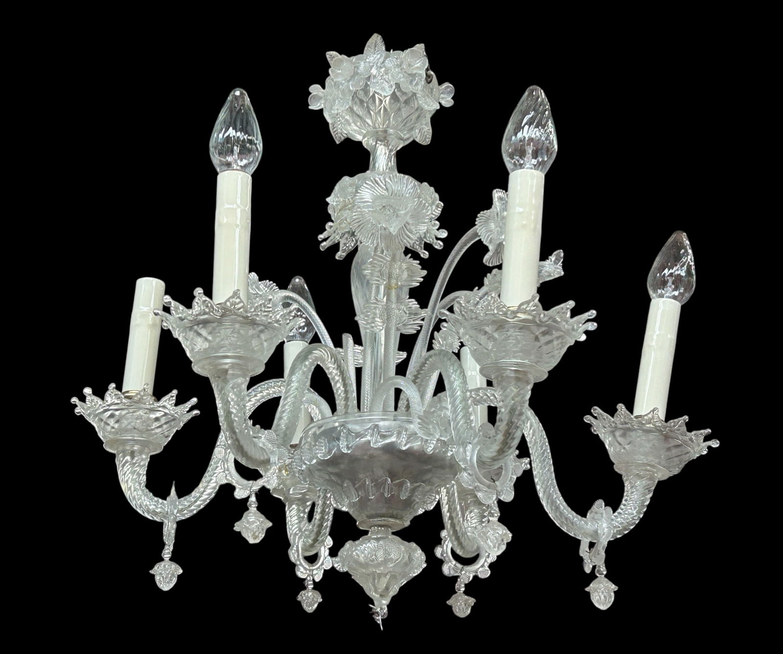 Ornate Murano ? Glass Chandelier w/ Flowers.: The ornate 6-arm Venetian glass chandelier features hand blown stemmed flowers, twisted glass arms, and other decorations. It measures 23" tall and 24 3/4" wide. Some of the parts are broken, but