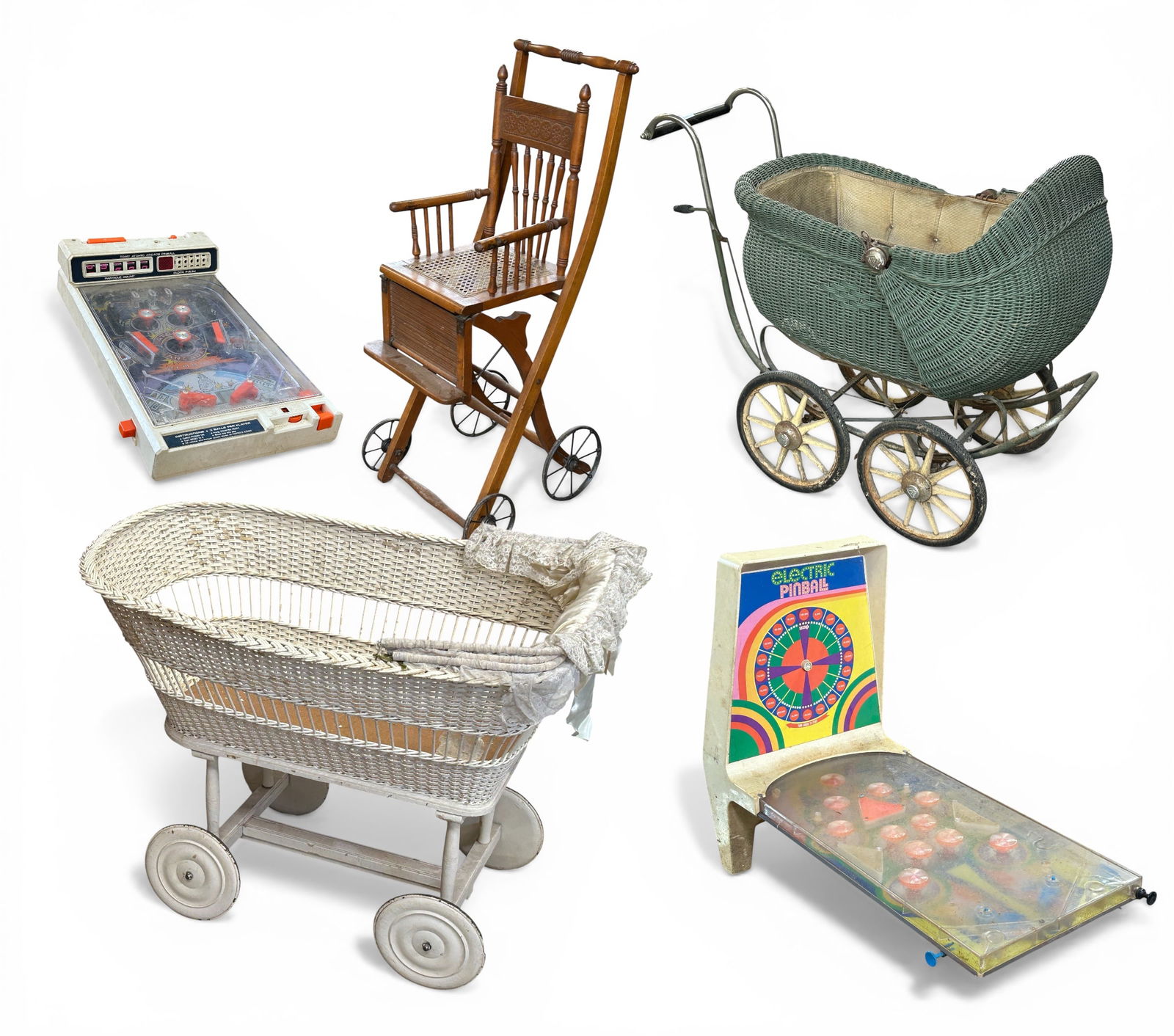 Two Antique Baby Carriages, Stroller, Pinball.: The two baby carriages are made from wicker. One is white, while the other is green. They are in rough condition, with lots of wear. The stroller is made from a medium color wood, possibly walnut,