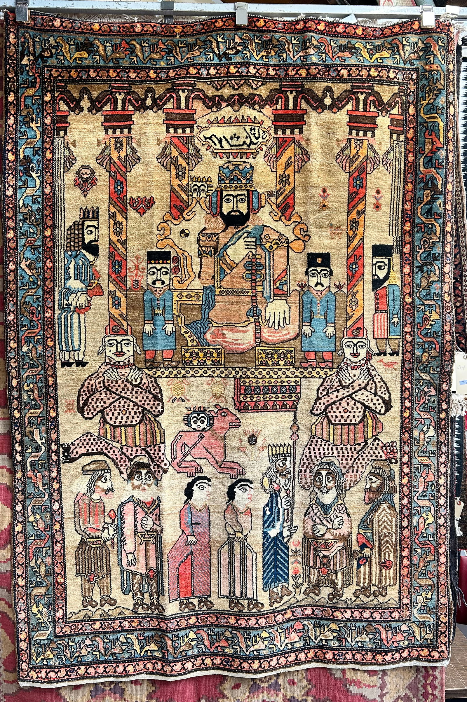 4' 4" x 6' 4" Persian Pictorial Rug.: The rug looks to be in good overall condition, with a little wear on the edges. In-house shipping is available for this rug. Please see our website regarding our in-house shipping procedures.