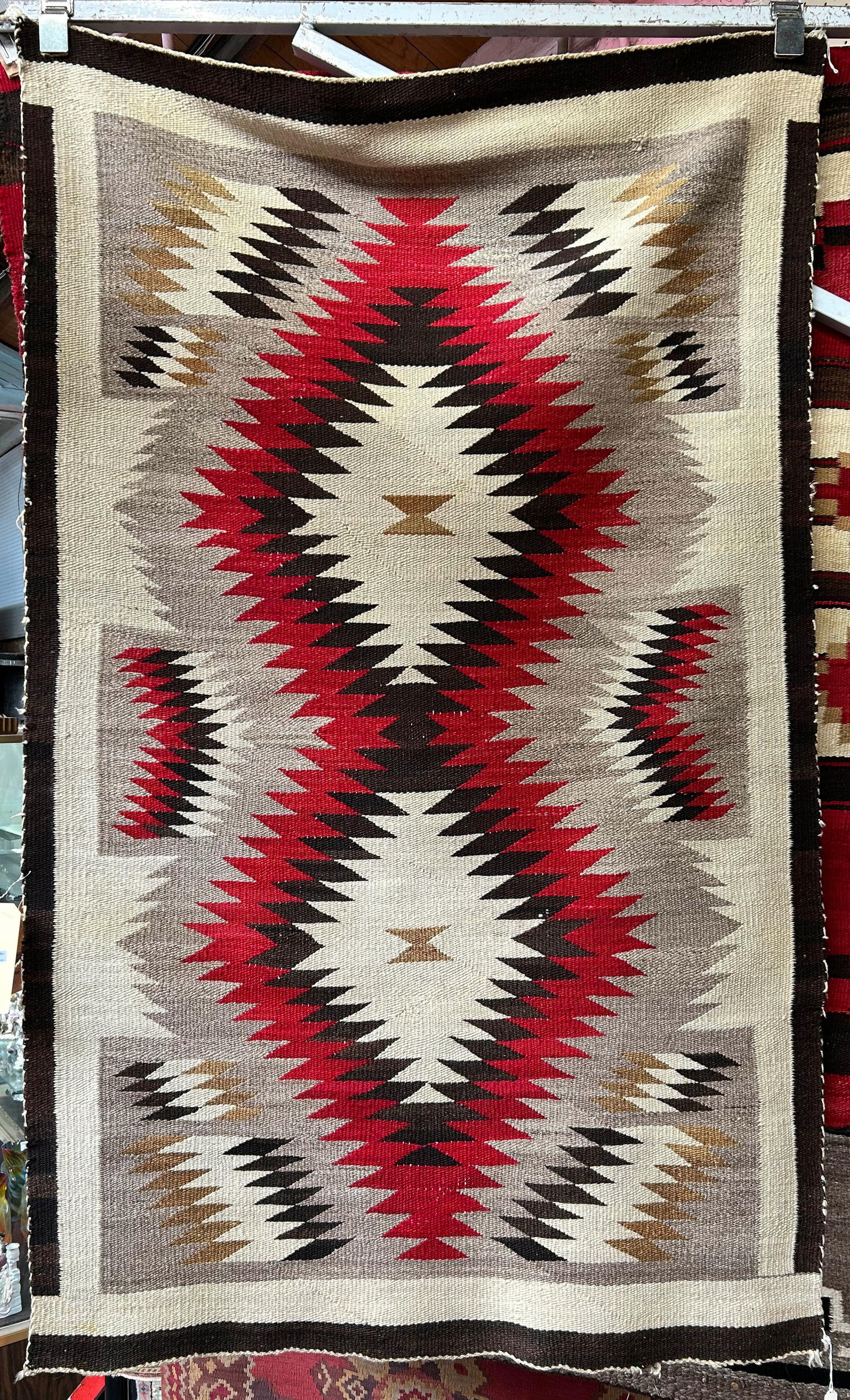 3' 1" x 5' Vintage Eye Dazzler Navajo Rug.: The rug has a small stain, and shows a little wear to use. Otherwise, it is in good overall condition. In-house shipping is available for this rug. Please see our website regarding our in-house