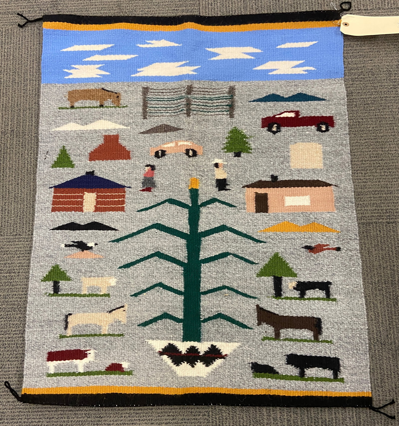 2' 1" x 2' 7" Pictorial Navajo Rug w/ Cars, People: The rug is in good condition. In-house shipping is available for this rug. Please see our website regarding our in-house shipping procedures.