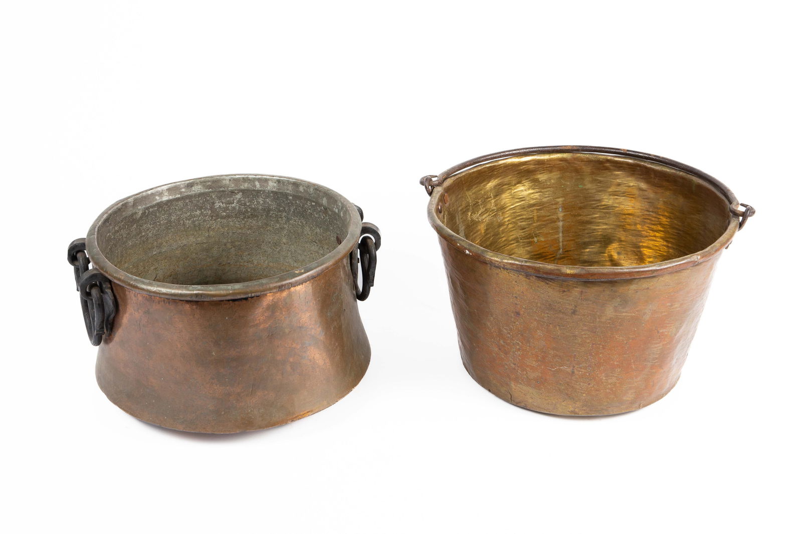 Lot: Copper Pot w/ Handles, Copper Pail.: They look to be hand wrought. The pail or bucket has a noticeable hole near the bottom, and some discoloration and surface wear. It measures 16 1/8" x 14 7/8" x 9 7/8". The copper cauldron with