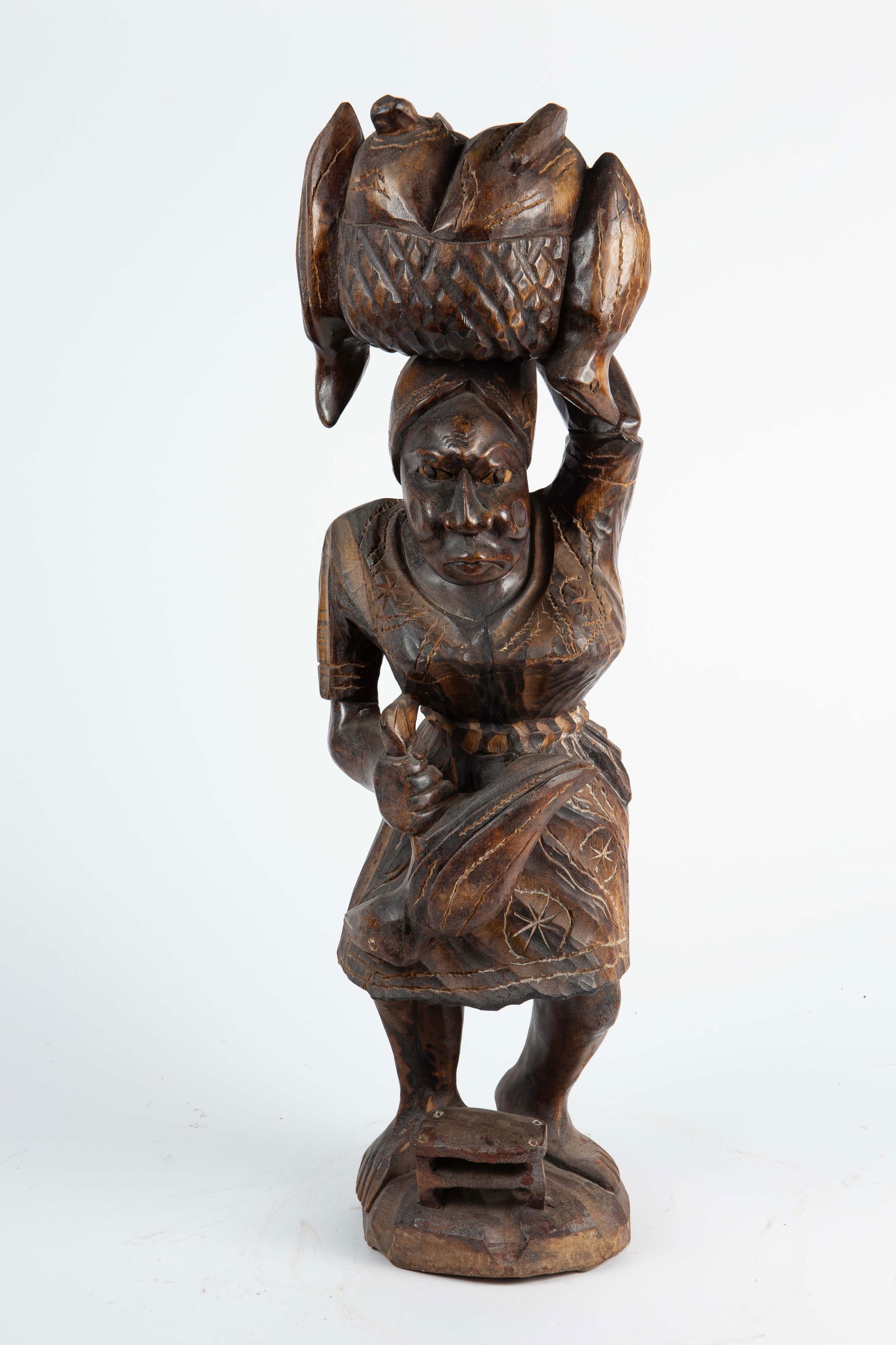 African or Caribbean Carved Wood Figure w/ Birds.: This sculpture represents a tribal woman carrying freshly killed fowl, with a full basket on her head. It appears to be unsigned. There are some scratches and nicks, but overall, it looks to be in