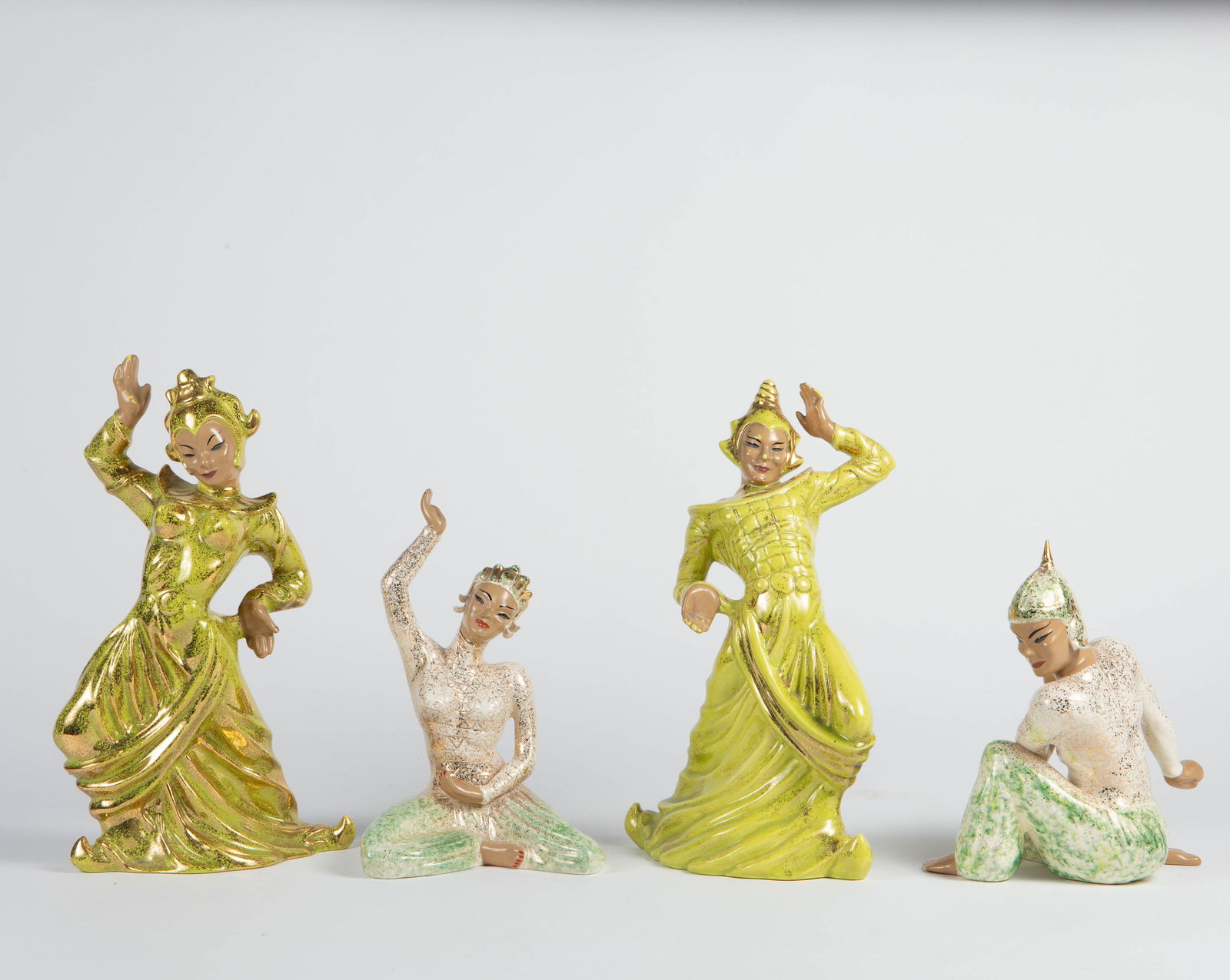 Lot of Mid Century Gilner & Yona Asian Dancers.: This lot includes pottery or porcelain figures of Southeast Asian dancers- possibly Thai or Balinese. There are four total - two men and two women. They look to be in overall nice condition. The large