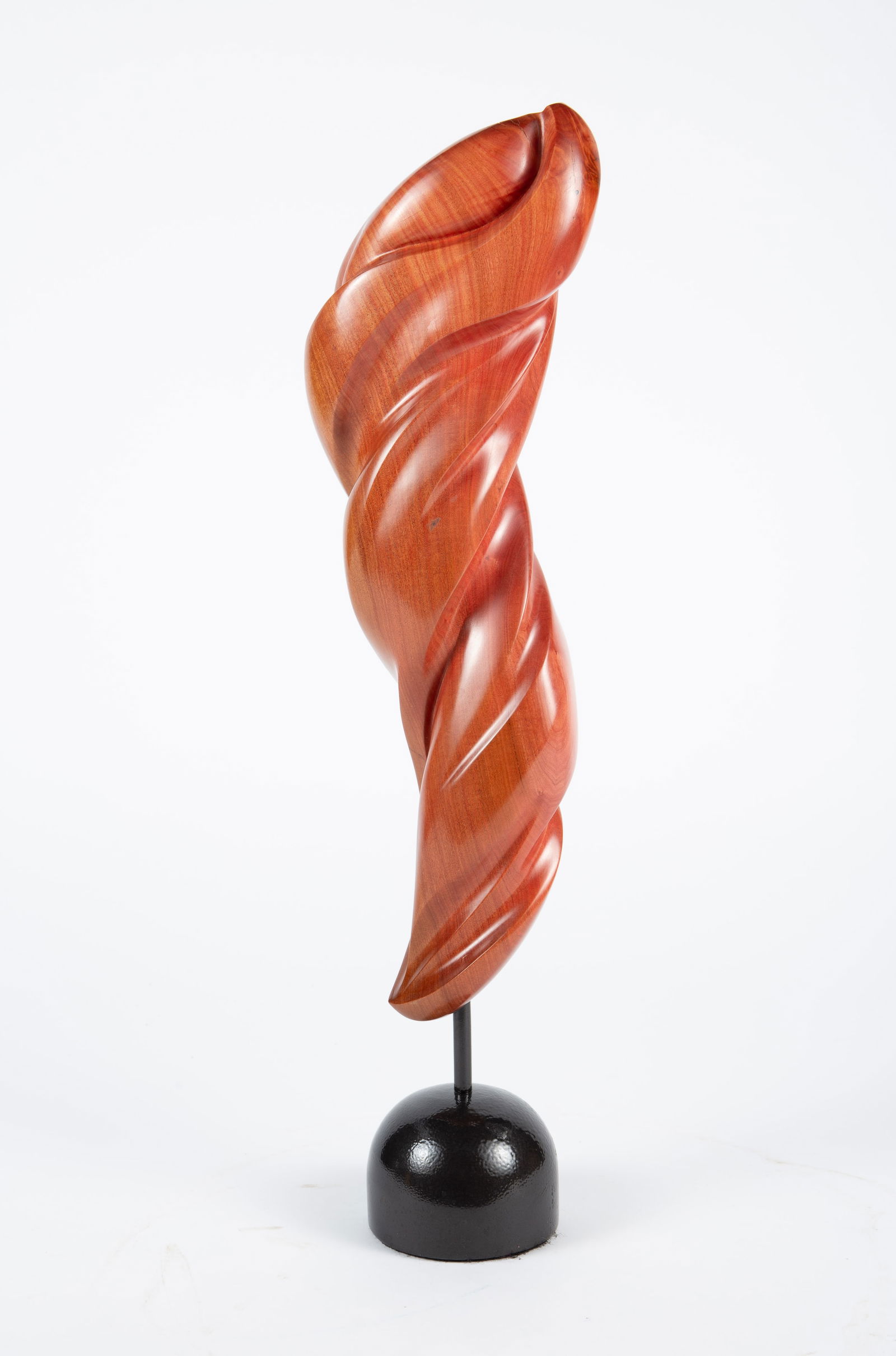 Carved Pink Wood Sculpture by Salem Barker.: The abstract sculpture by Salem Barker (South Beloit, IL) is carved from African pink ivory wood. The piece is signed Salem Barker / Pink Ivory on the bottom around the metal post, which connects the