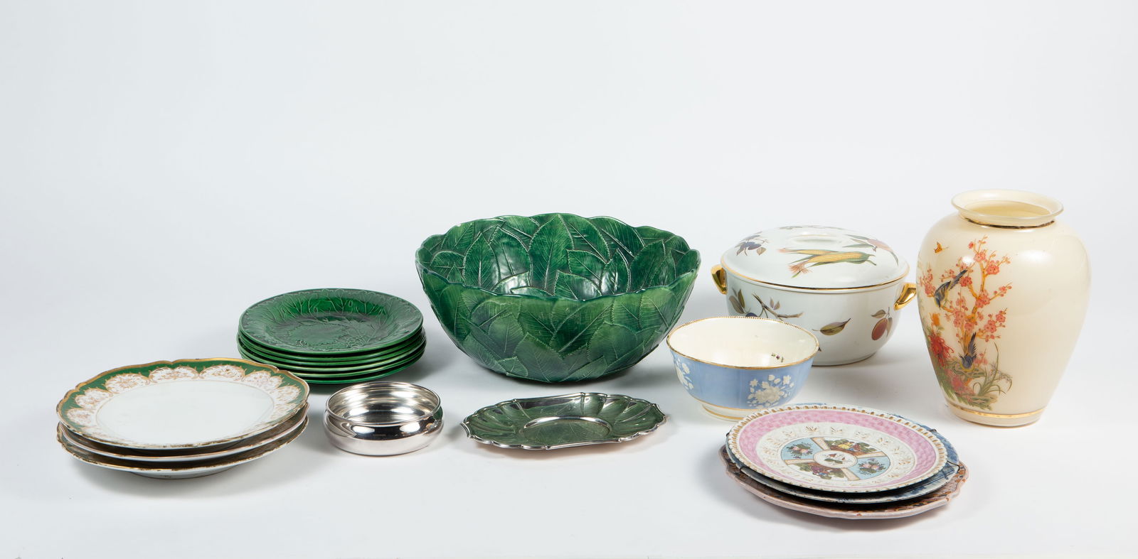Lot of Vintage Ceramic & Glass Items: There is a large Ceramiche Leonardo majolica foglia green punch bowl and 6 unbranded plates, a Royal Worcester Evesham baking dish and server, and a Bristol glass vase with nightingale birds. There
