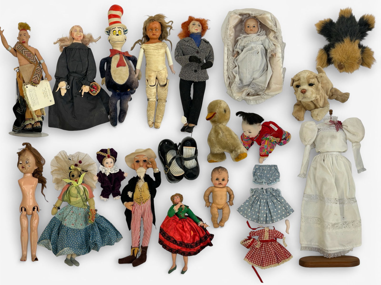 Lot of Assorted Vintage Dolls & Toys.: Some items are in better condition than others. The lot includes a Dr. Seuss "Cat in the Hat" plush, an Effanbee witch doll, two handmade cloth dolls, a Japanese baby doll, a Sandy American Indian war