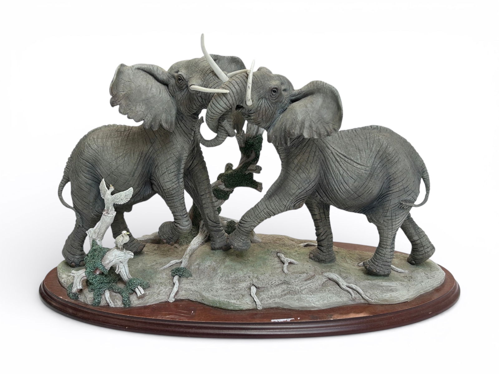 Lenox "Thundering Plains" Elephant Figural Group.: It is numbered 1090/2500. It has been repaired. There is also some dust and dinginess present. The piece measures 19" x 9 1/4" x 12 1/4". Third-party shipping or personal pickup is required. Please se