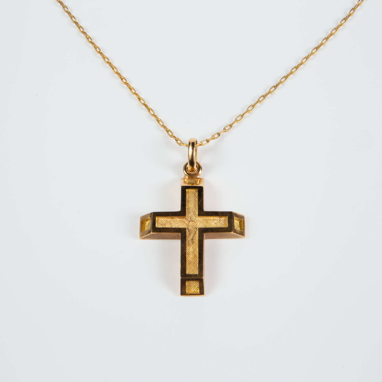 18K Gold Cross Pendant on 14K Gold Chain.: The stylized Latin cross pendant is marked A37 / 750 on the back. It measures 26mm x 22mm (not including the bale), and weighs 3.6 Pennyweight, or 5.6 Grams. The 24" chain is marked A47 / 585 on the c