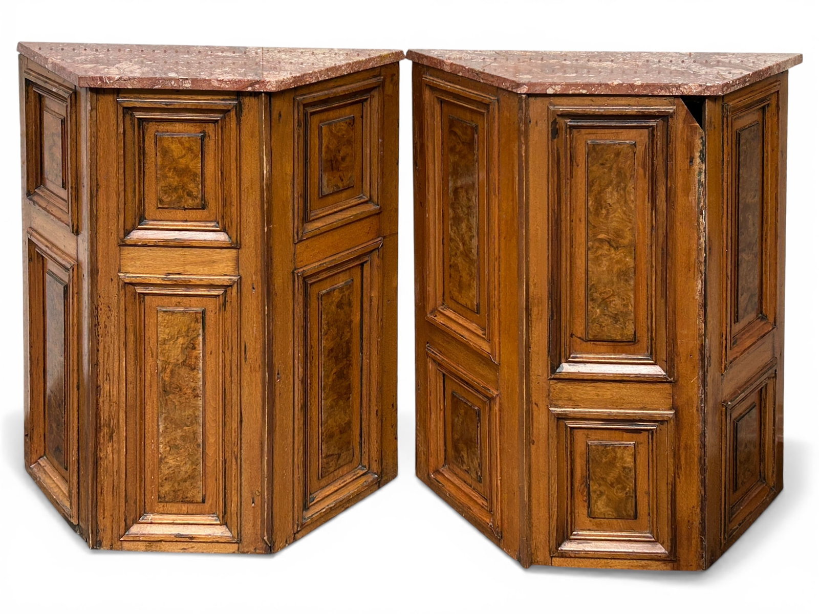 Pair of Antique Marble Top Console Tables.: These console tables or stands are designed to stand against a wall. They are decorated with burled panels, One of the tables is damaged, with a chunk of wood missing from the top right of the front