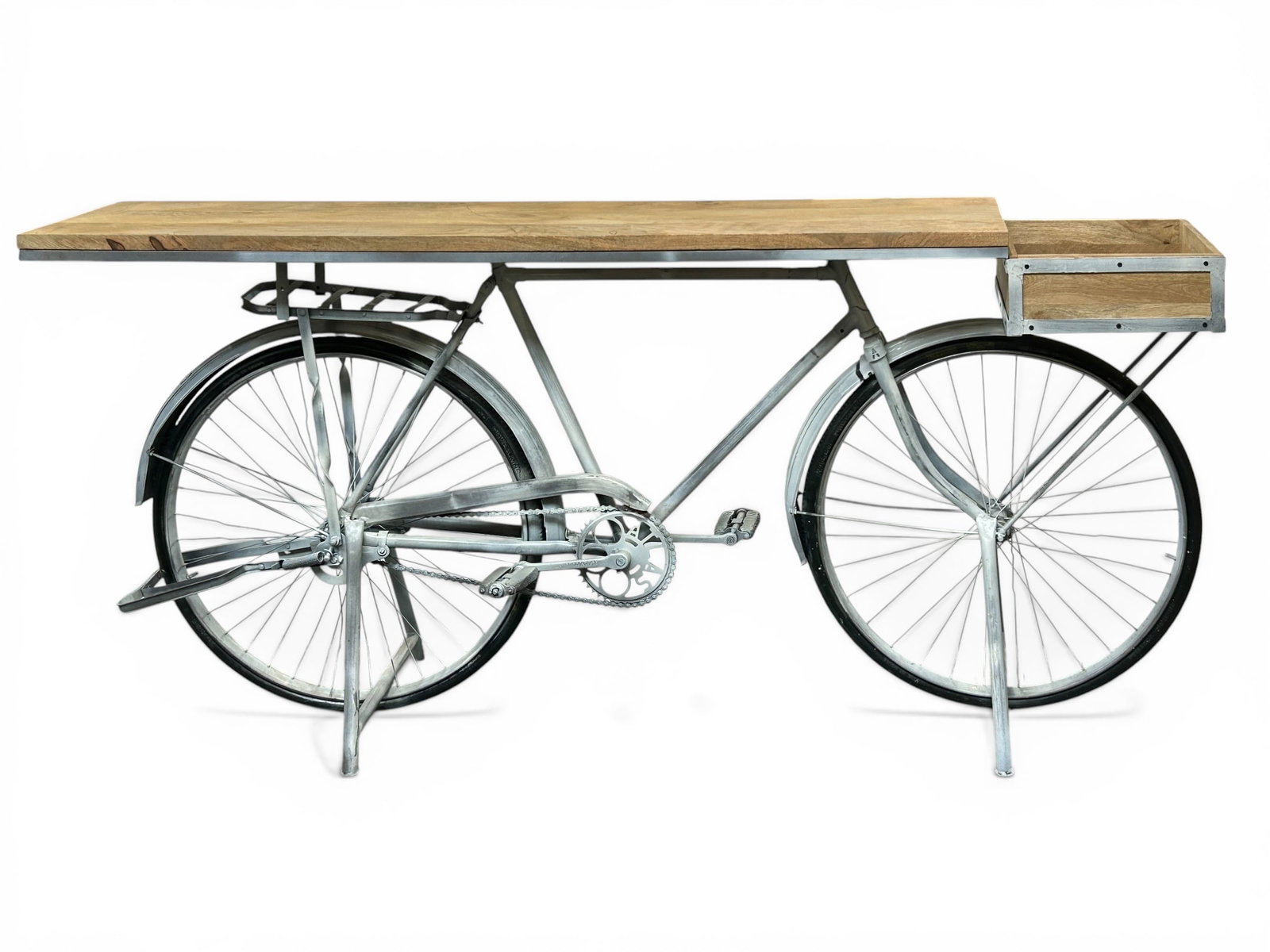 Thomas White Cycle Bar Table - World Piazza.: The table has a light wood top with an upcycled bicycle base. The table is in excellent condition, and has its original tag. It measures 78" wide, 19" deep, and 36" tall. Third-party freight shipping