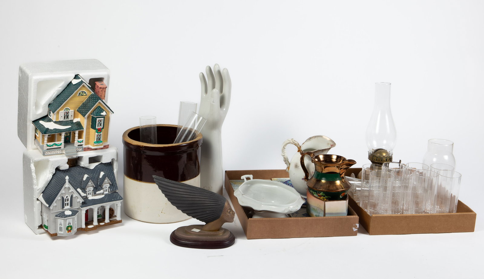 Mixed Lot: Stemware, Stoneware Jug, Oil Lamp. More: The lot contains 38 items. There are pitchers, glass tumblers, tall stemmed cordials, 4 glass chimneys, an brass oil lamp, a tall hand sculpture, tiles, and more. Some of the specific items included a