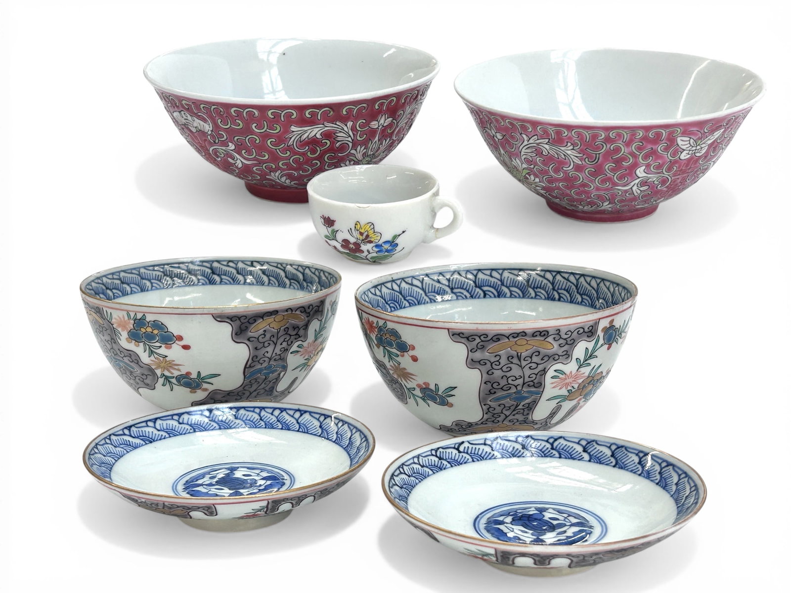 Lot of Chinese Porcelain Bowls, Saucers, Cup.: The tiny cup is chipped and has a hairline crack in the handle. All of the other pieces look to be in good overall condition. There are two blue and white gilded bowls with matching saucers, as well a