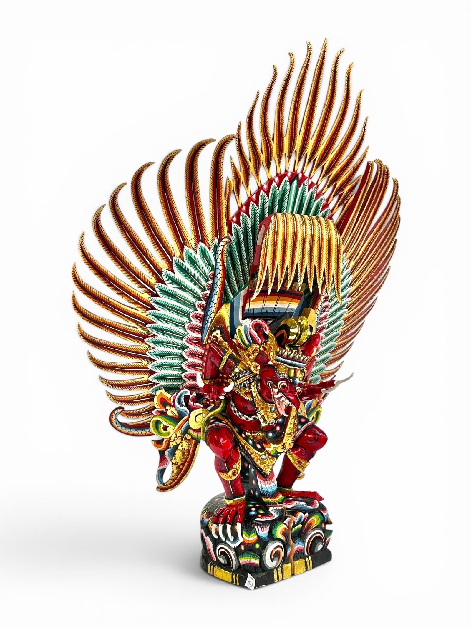 Possibly Balinese Carved Colorful Garuda Statue.: There is a sizable crack at the base. The rest of the statue looks to be in nice condition. The sculpture measures 27 1/2" x 14" x 38 3/8". In-house shipping is available. Please see our website regar