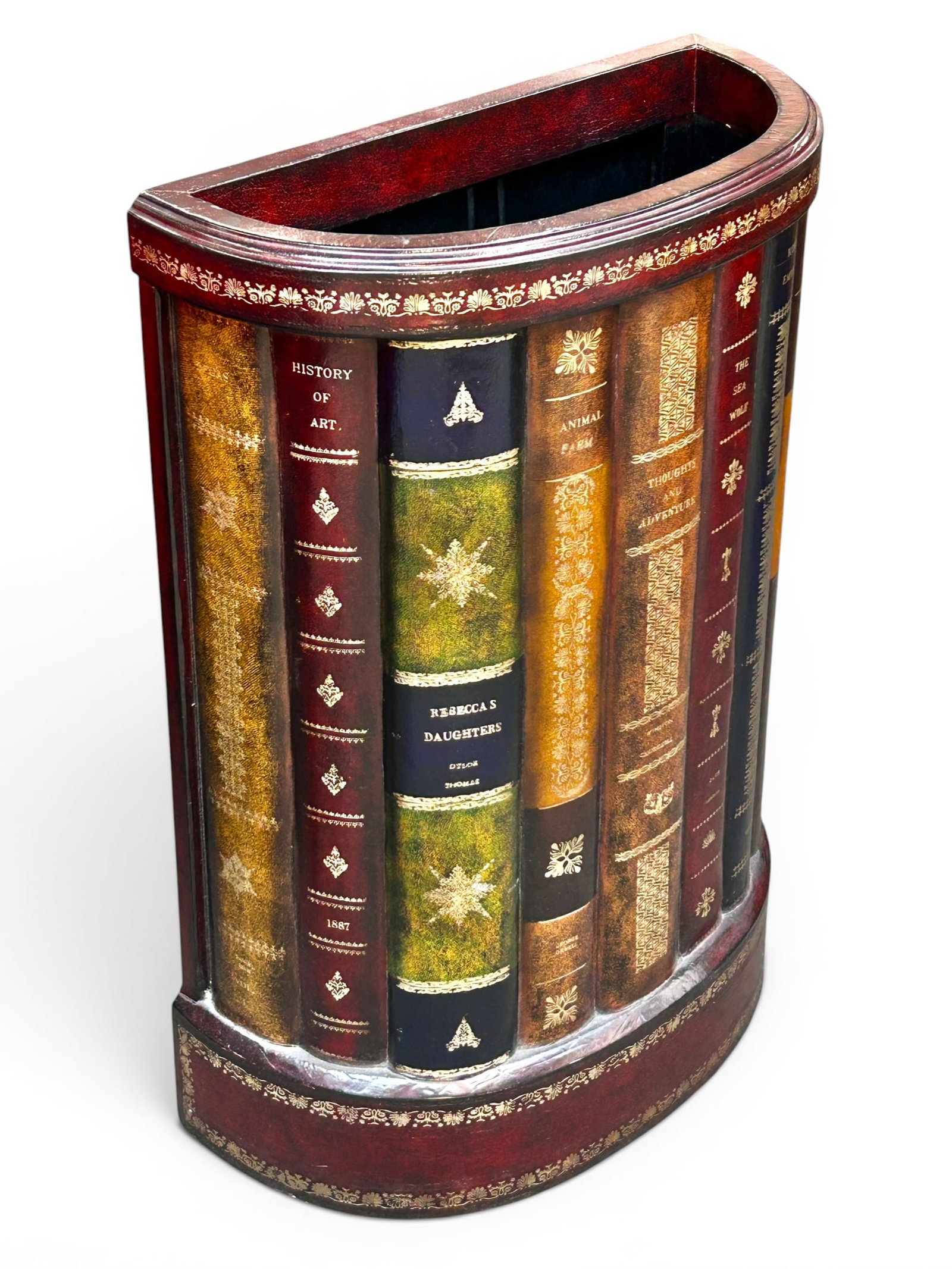 Book Spine Umbrella Stand or Tall Wastebasket.: This contemporary umbrella stand or waste can is decorated with the spines of classic books. It is in good condition, with only minor wear. The stand measures 18 1/2" wide, 8 1/2" deep, and 27" tall. 