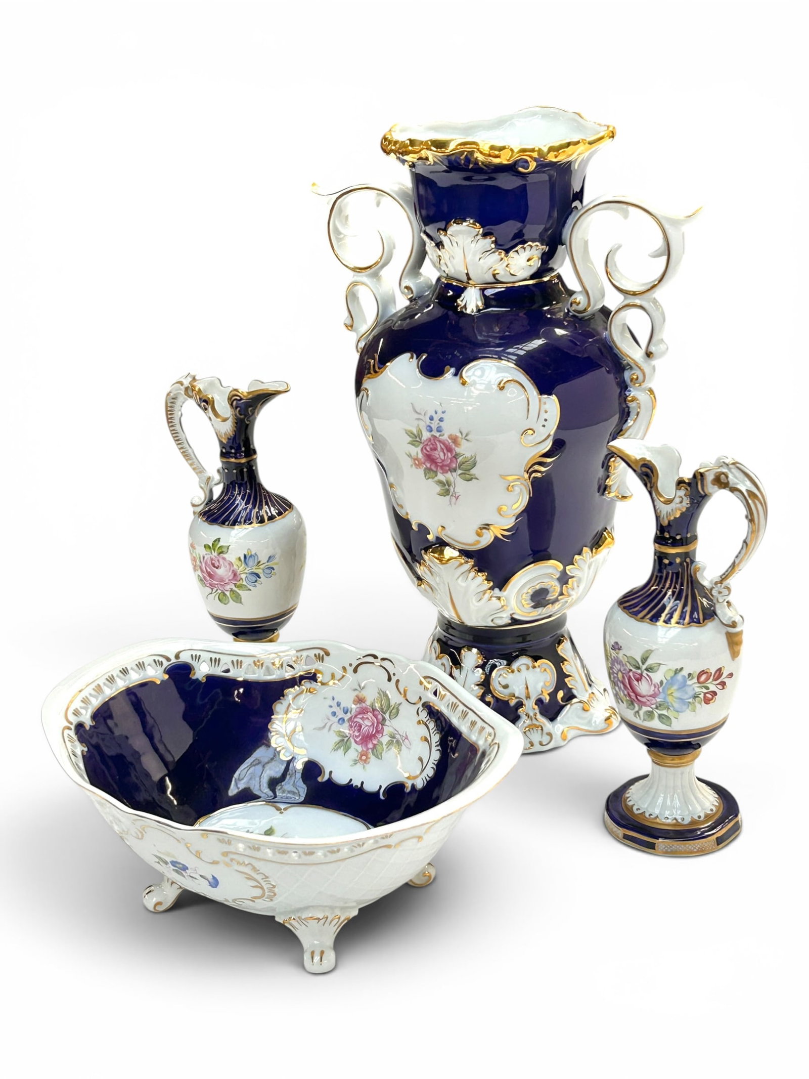Lot of Hungarian & German Porcelain.: This lot contains 4 pieces of porcelain- a large Hollohaza vase, a footed Hollohaza bowl, and a pair of 8 1/4" ewers. Overall, the lot looks to be in nice cosmetic condition. The largest item is the v