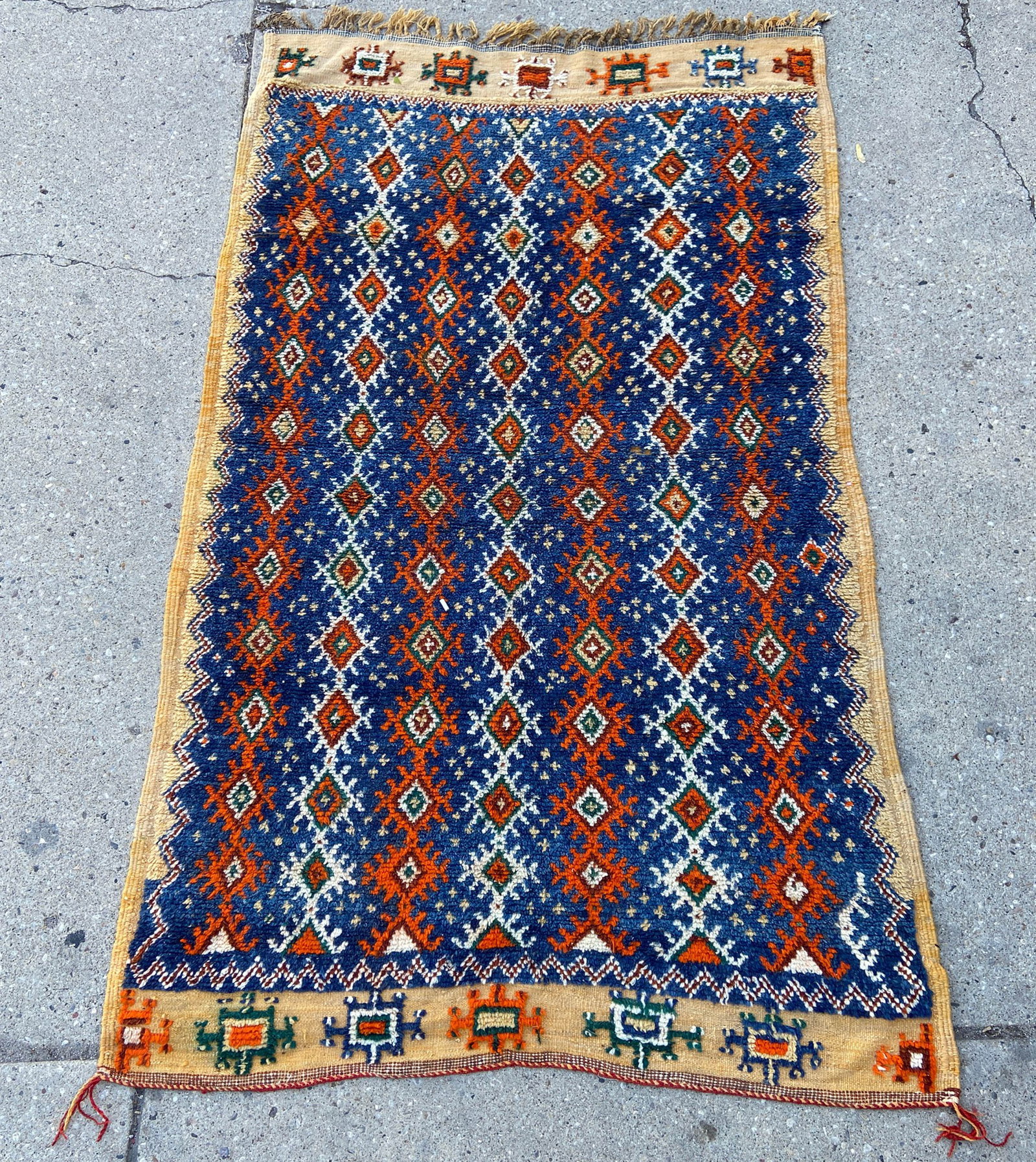4' 4" x 7' 1" Vintage Blue Moroccan Rug.: The colors on this rug are both unusual and vibrant. In-House Shipping is available for this rug. Please see our website for our in-house shipping procedures.