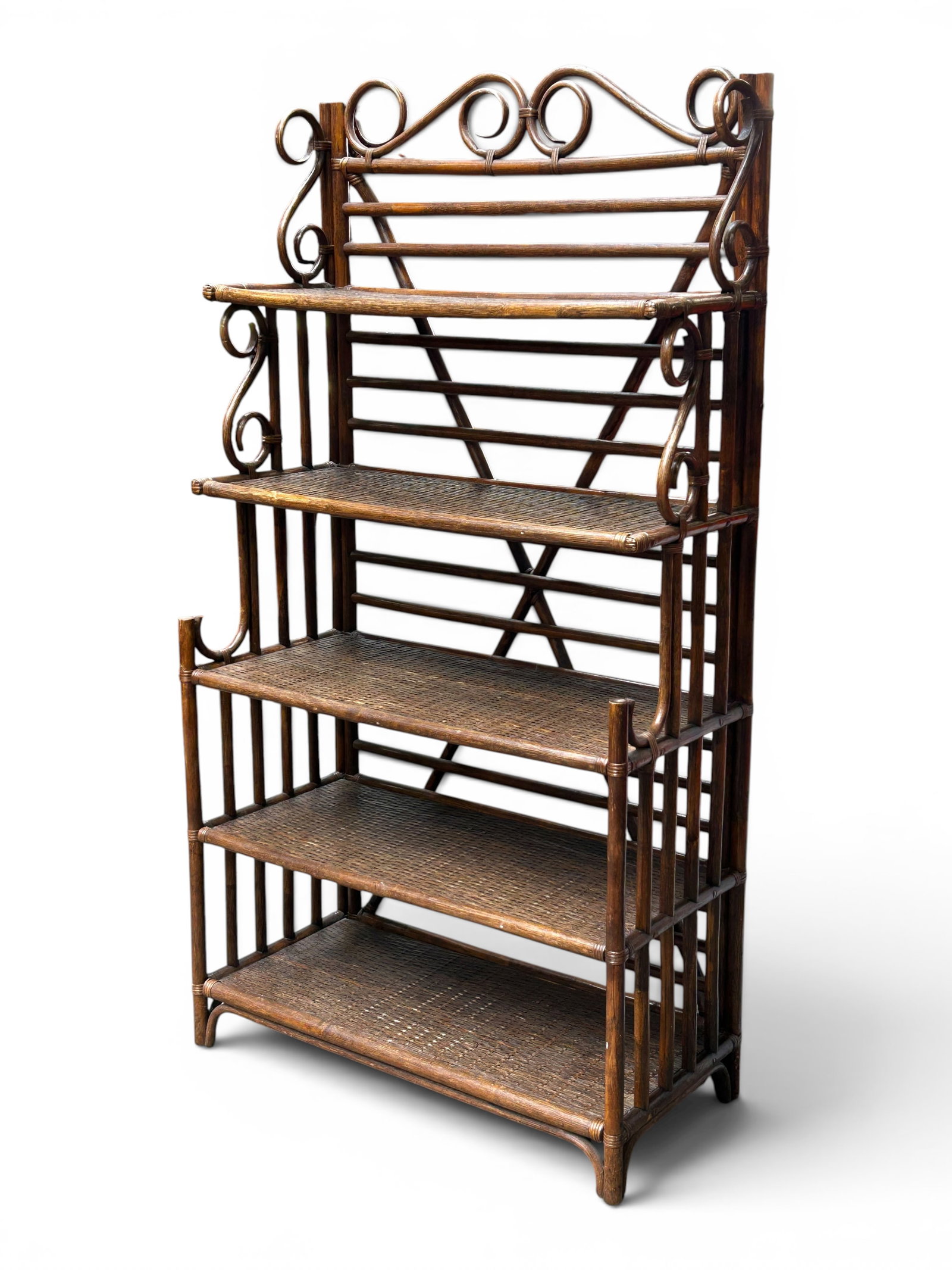 Vintage Rattan Etagere or Baker's Rack.: The vintage stepback piece has a rattan frame with scrolled decorations, and 5 shelves with woven surfaces. It measures 72 1/2" tall, 39 1/8" wide, and 18 1/4" deep. The highest shelf is a bit warped,