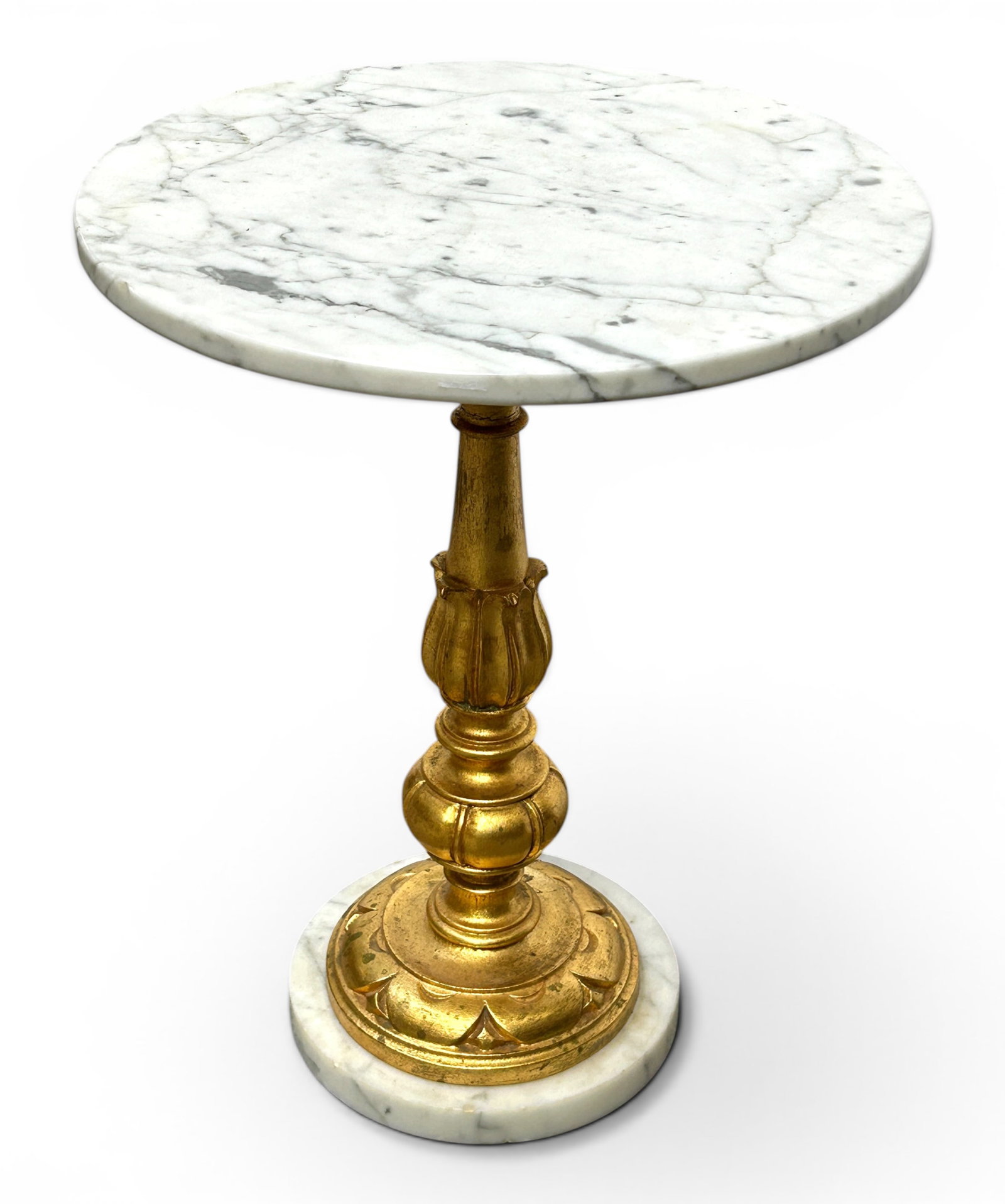 Hollywood Regency Style Marble Giltwood Side Table: The small table has a round white marble top and bottom joined by a carved and gilded wood post. It measures 17 1/2" tall, and up to 14" in diameter. There is a chip on the top edge, and a few chips o
