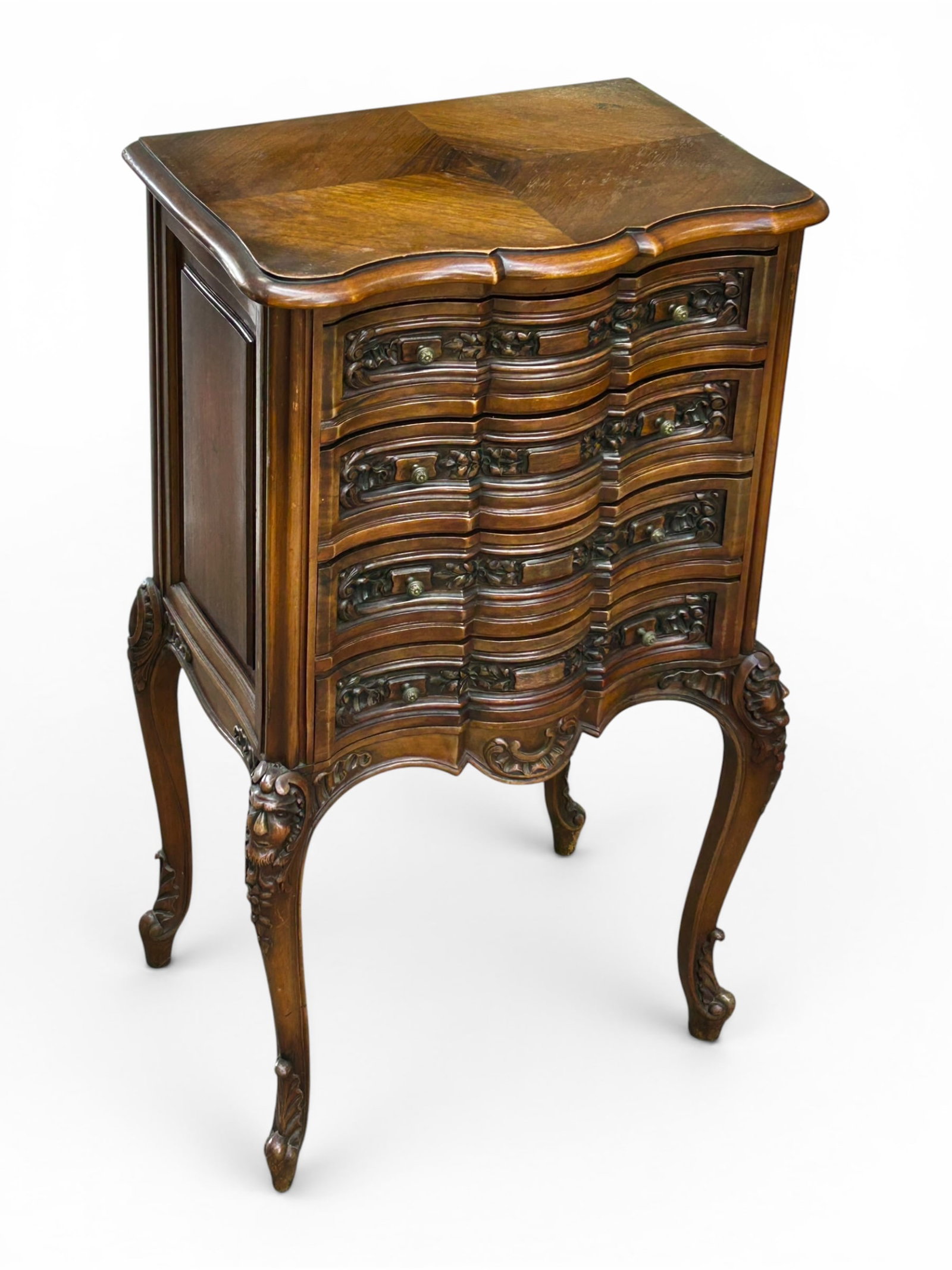 French Carved Walnut Silverware Chest w/ Faces.: The antique silverware chest on legs has 4 drawers with floral and scroll carvings, a carved apron, and 4 cabriole legs with carved "Green Man" faces on the two front ones. It measures 39 1/2" tall, 2