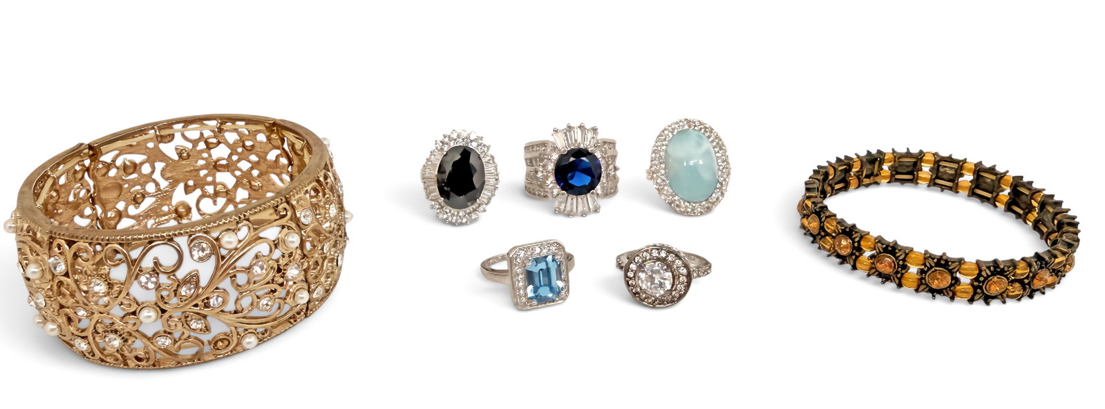 Lot of Jewelry, inc. 5 Sterling Rings.: The lot contains 7 pieces of jewelry. There are two stretch bracelets with rhinestones, and 5 sterling rings with semi-precious stones. The rings are marked 925, 925 LA, and S925. They feature onyx, a