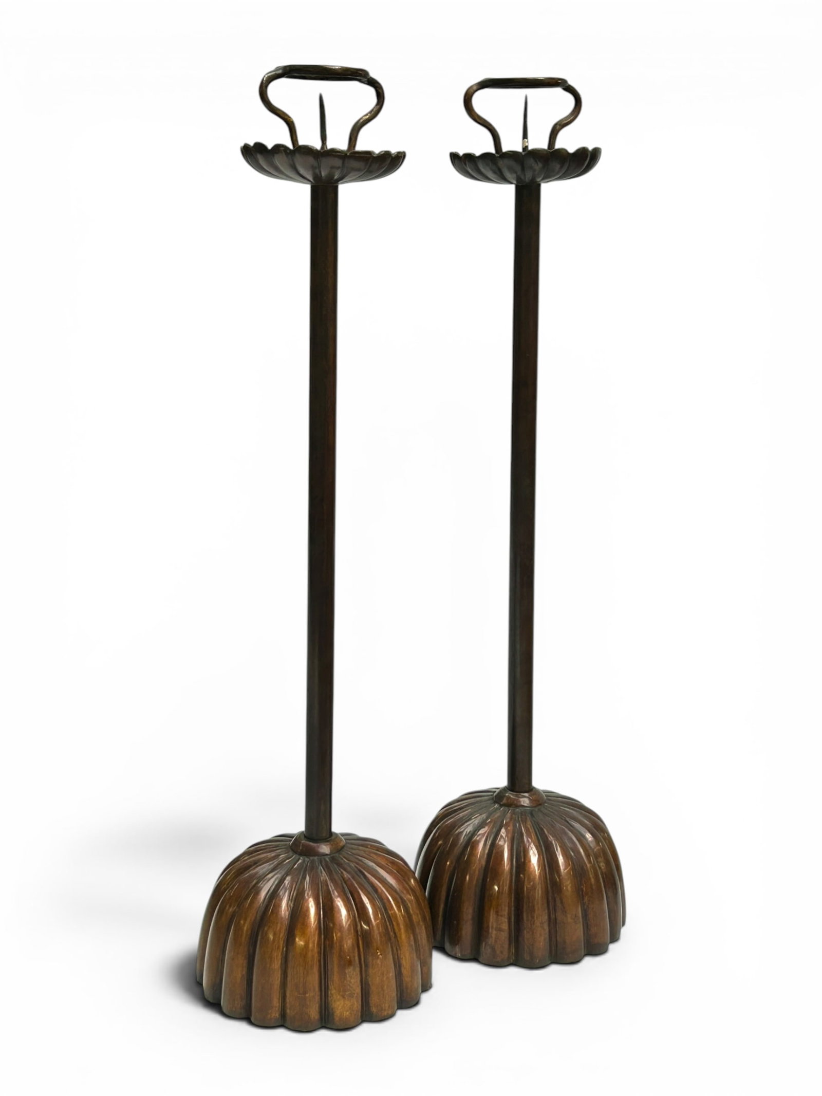 Pr. of Antique Japanese Bronze Candlesticks.: The pair of tall candlesticks or shokudai have a ribbed chrysanthemum style base and crown. They have a 2" round opening to the pricket. They measure 23 1/2" tall, and up to 6 1/2" in diameter. There