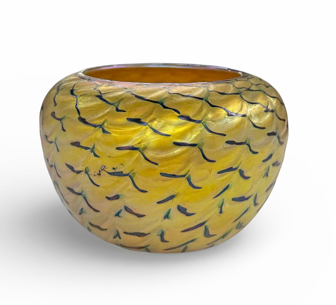 Lundberg Studios 1994 Indian Basket Vase.: This golden iridescent glass vase is signed underneath, and numbered 052255. It appears to have a few small scratches, but is in nice condition overall. It measures 5 1/2" x 5 1/2" x 3 3/4". In-house 