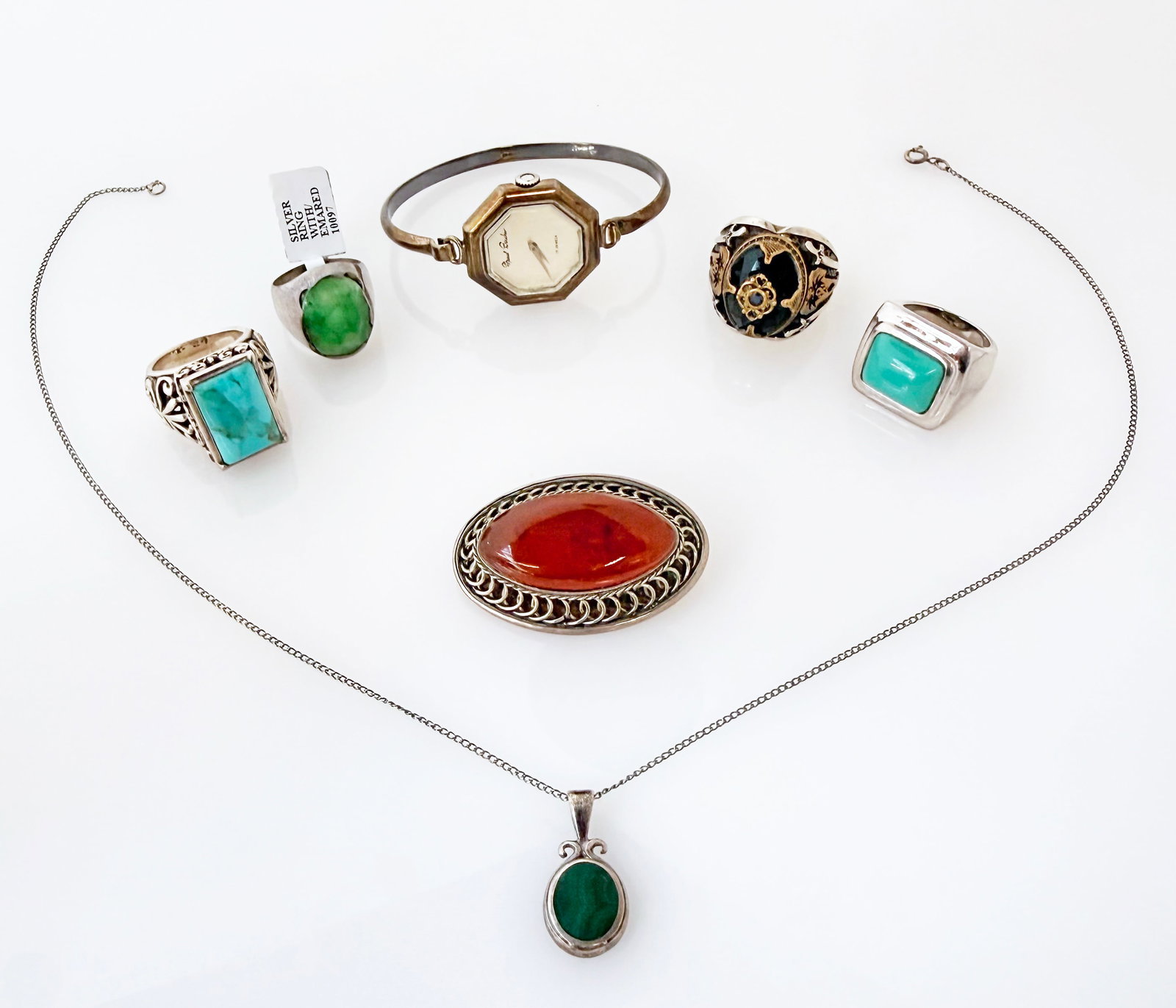 Sterling Silver Jewelry - Barse, Boucher, Guyot.: The lot contains 7 pieces of sterling silver jewelry. There is a Marcel Boucher 17 jewel watch, a Barse turquoise ring, a Deb Guyot turquoise ring, and a hand made ring with an emerald. The lot also c