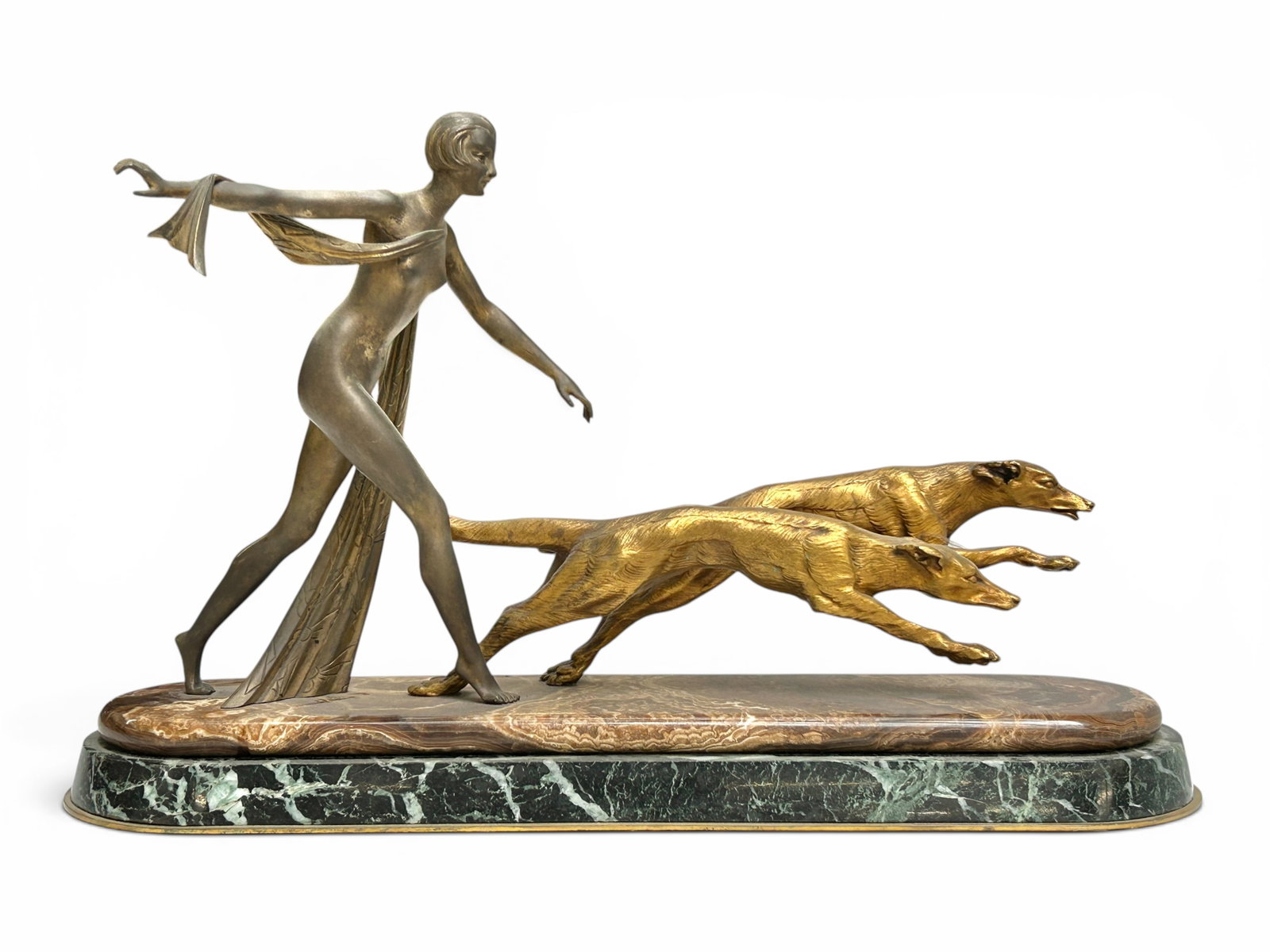 French Art Deco Bronze Sculpture, Woman & Dogs.: The bronze figural sculpture depicts a nude woman running after a couple of greyhounds. The piece is set on a brown onyx slab with rounded edges, which is atop a black and green marble slab with a low