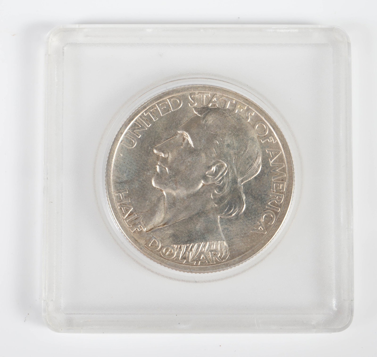 1937-D Daniel Boone Commemorative Half Dollar.: This ungraded coin looks to be in nice condition. There is a tarnish spot on the D and also on the Native American Indian's knee. In-house shipping is available. Please see our website regarding in-ho
