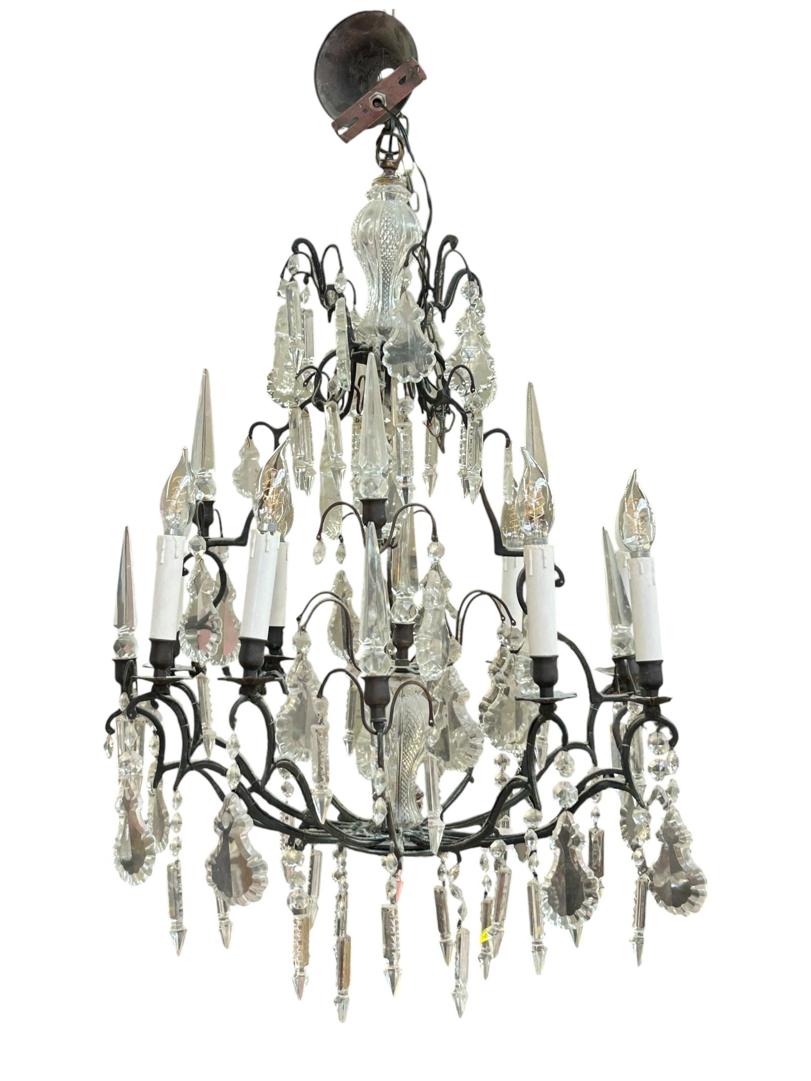 Wrought Iron 12-Arm Prism Chandelier.: The birdcage style chandelier has 12 arms, but only 9 lights. It features a variety of prisms and a cut crystal post on the bottom and the top. It measures 34" long and 25" in diameter (not including 