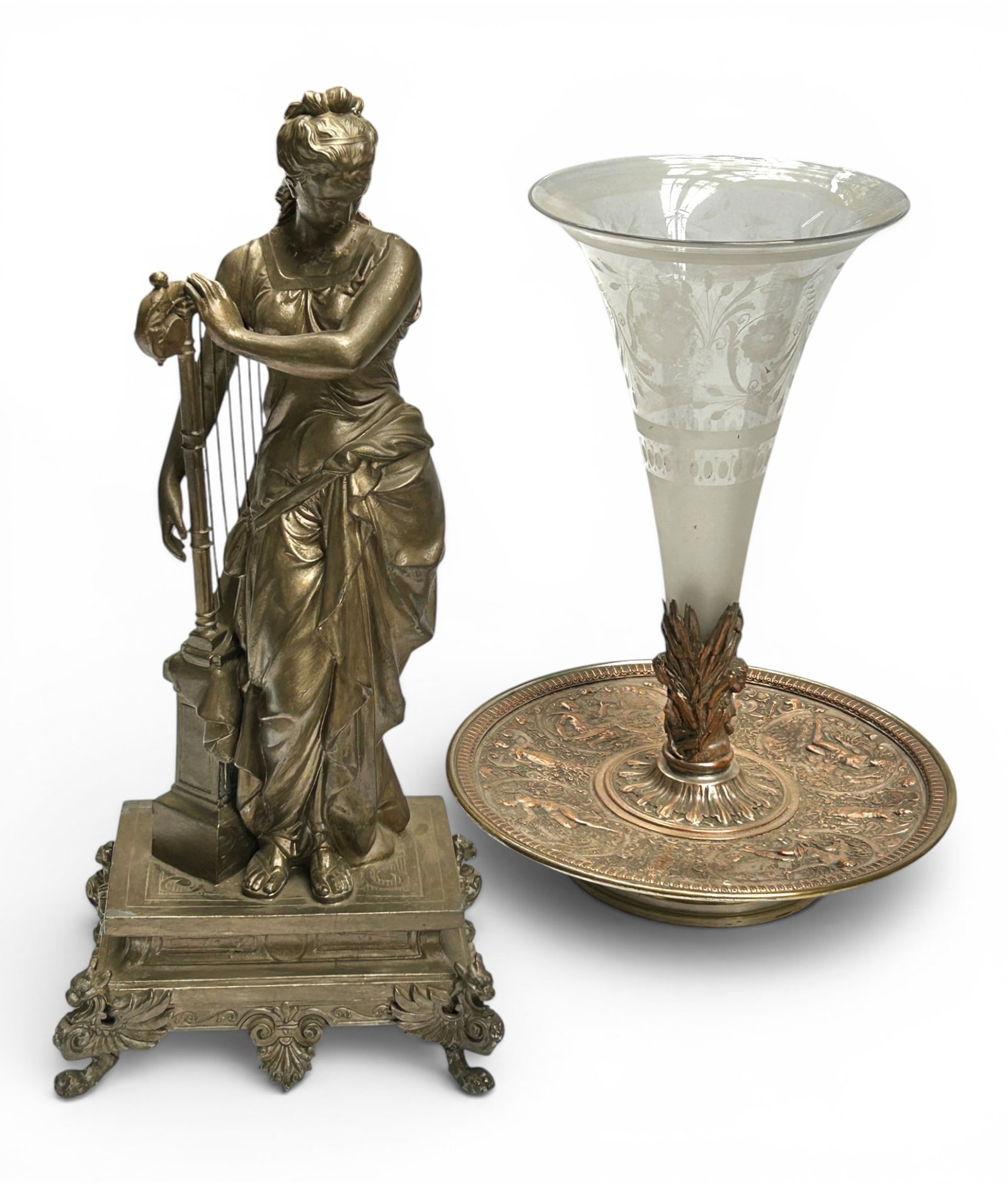 Sculpture of Harp Player & Etched Trumpet Epergne.: The lot contains 2 vintage or antique items. There is a cast spelter statue with a muted gild finish which depicts a draped Greco-Roman style female harp musician. It measures 17 3/4" tall. The lot al
