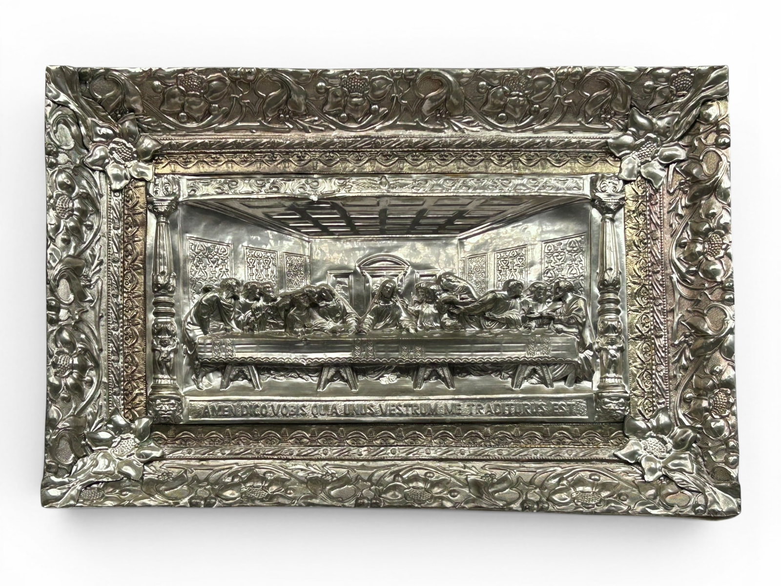 Lg. Metal High Relief Last Supper Wall Art.: The vintage religious art piece is composed of silver toned tooled metal, and depicts "The Last Supper" with ornate borders, including a floral and foliage outer frame. It measures 22 3/4" x 34" x 2 1