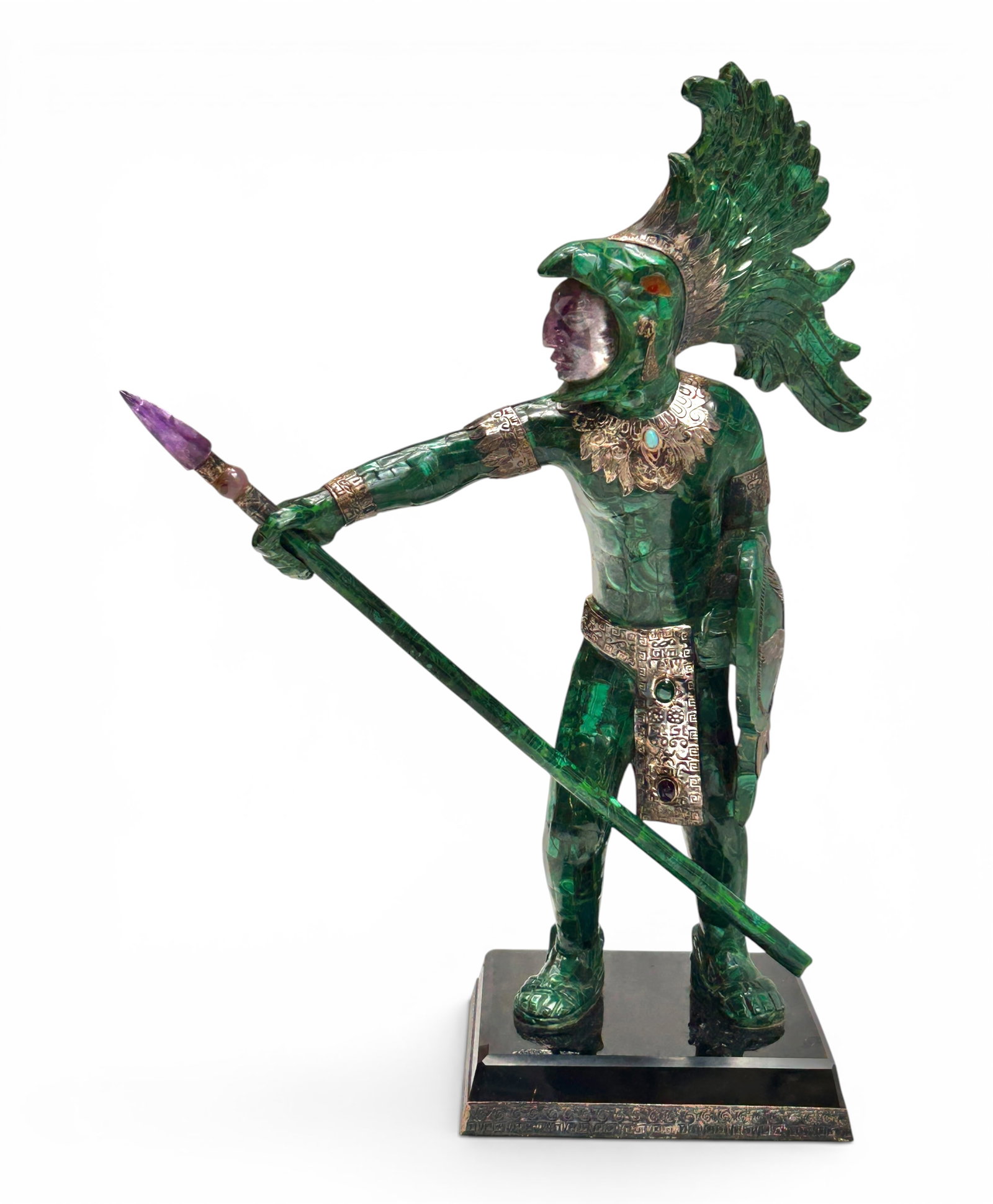 Tessellated Aztec Warrior Sculpture - Malachite.: The intricate sculpture is mainly composed of tessellated green malachite stones, a carved amethyst face and spear tip, and possibly silver decorative elements. It measures 16 1/4" tall, 11" wide, and
