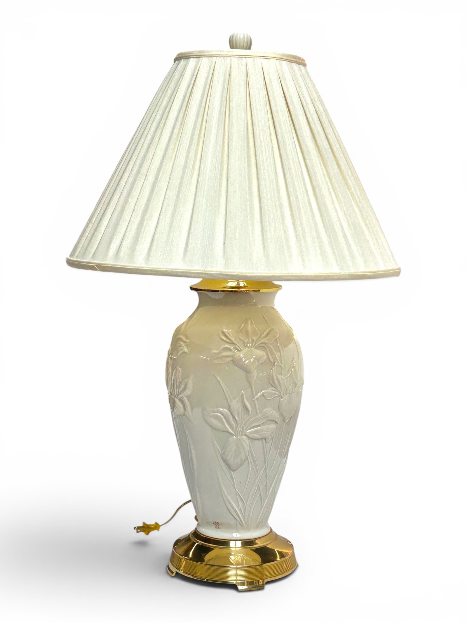 Lenox Porcelain & Brass Floral Table Lamp.: The lamp is branded Lenox on the underside, on the porcelain section, and on the upper hardware. The porcelain features relief long-stem flowers, and the piece has a ribbed and polished brass base. It