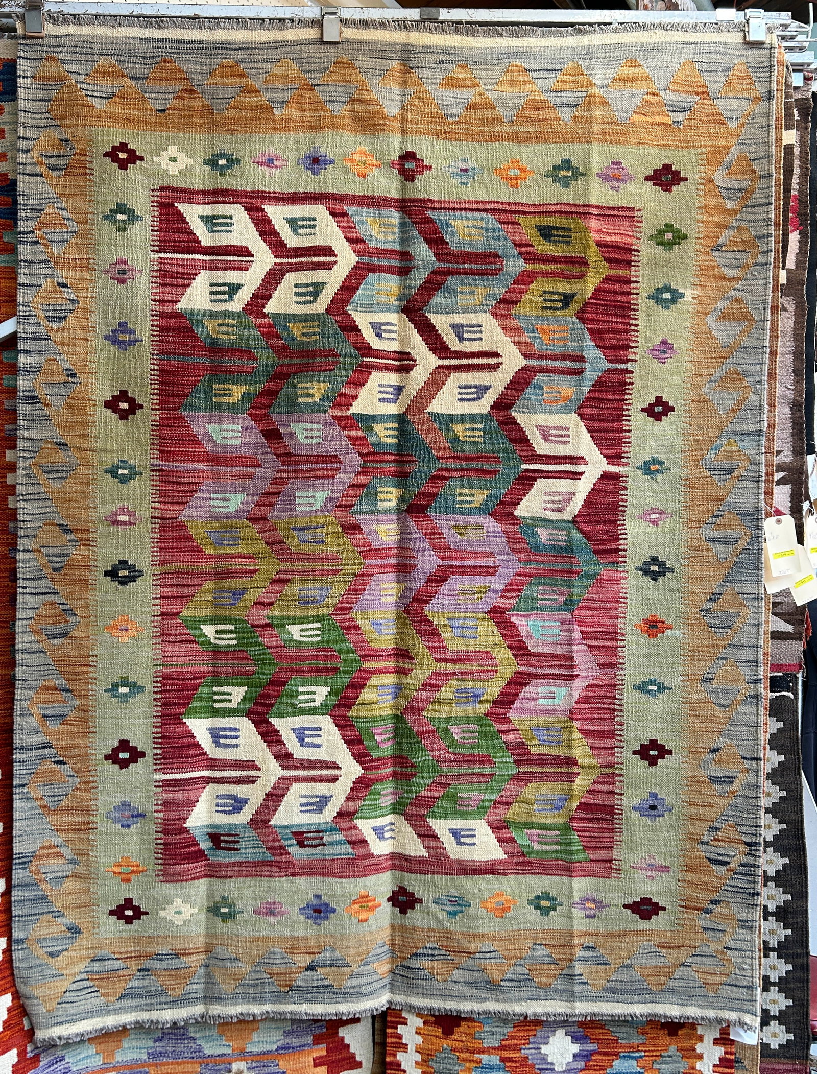 5' x 6' 7" Colorful Kelim Rug.: This rug has beautiful colors, and would likely fit well with any decor. It is in good condition. In-House Shipping is available for this rug. Please see our website for our in-house shipping procedur