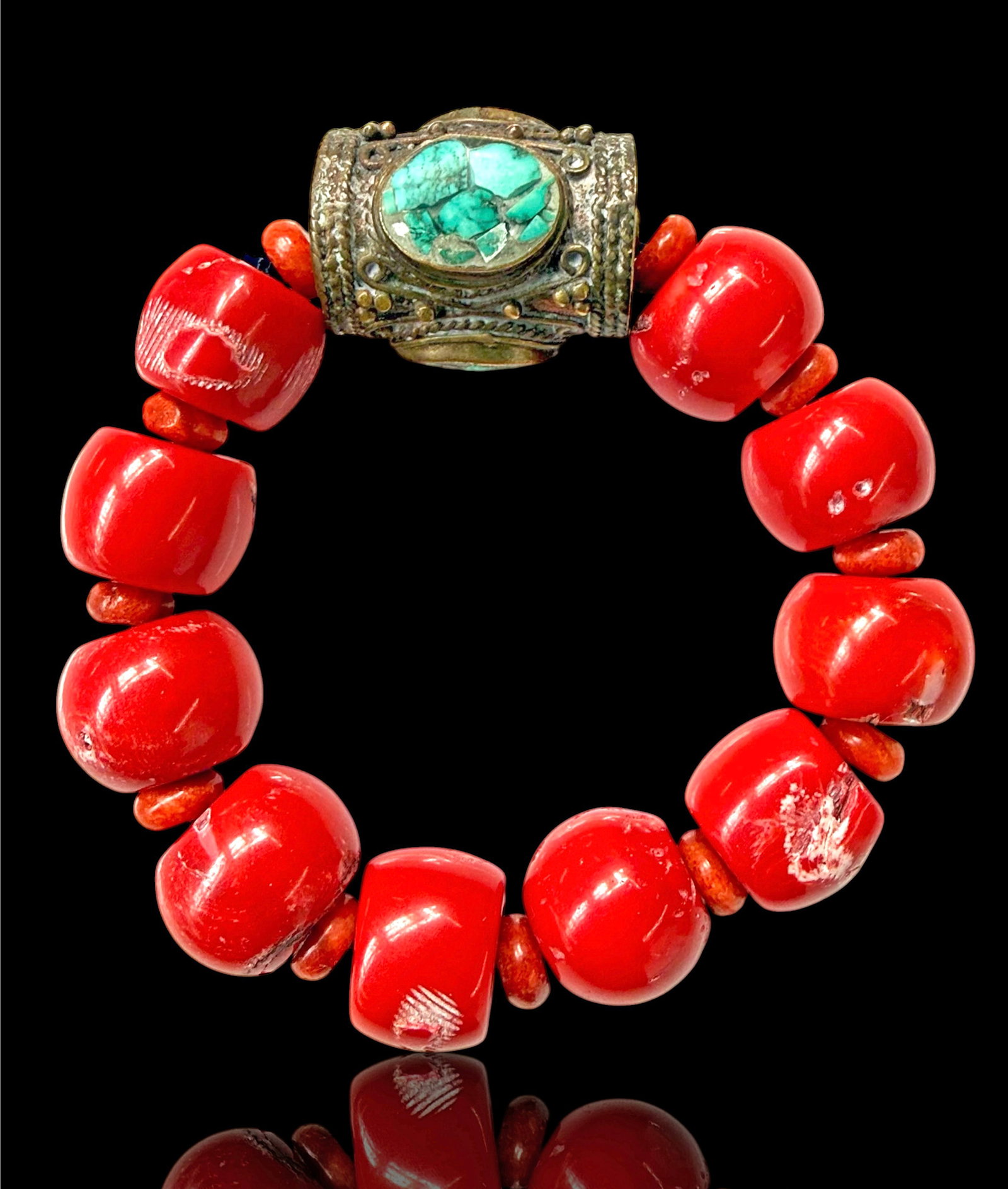 Red Coral & Turquoise Chinese Bracelet.: The bracelet has large and small red coral beads, and what looks like a bronze cylindrical decoration with inlaid turquoise small pieces. The bracelet looks to be in good overall condition, though the