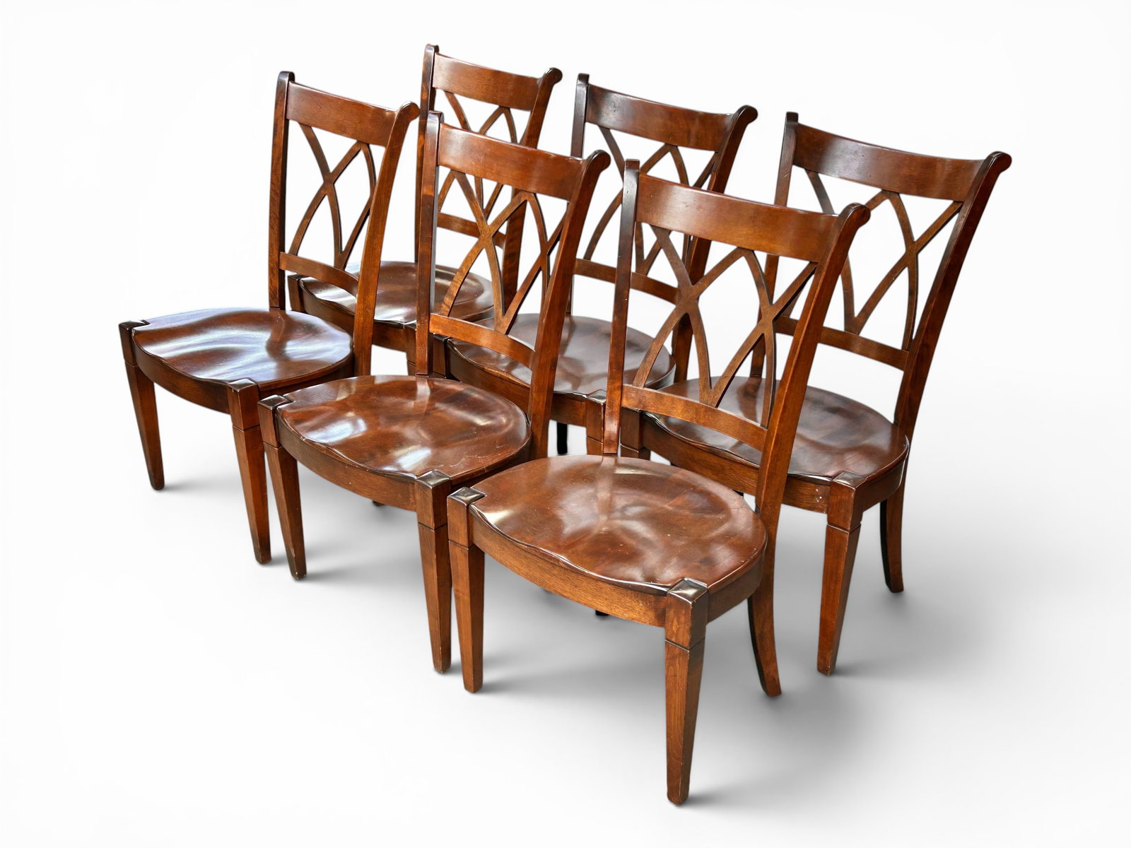 6 Nichols & Stone Trellis Back Wood Dining Chairs.: The vintage chairs feature a pierced trellis back design and wide seats. Each measures 38 3/4" x 21 1/2" wide, and 23" deep. There are some scratches, stains, and indentations on the chairs.