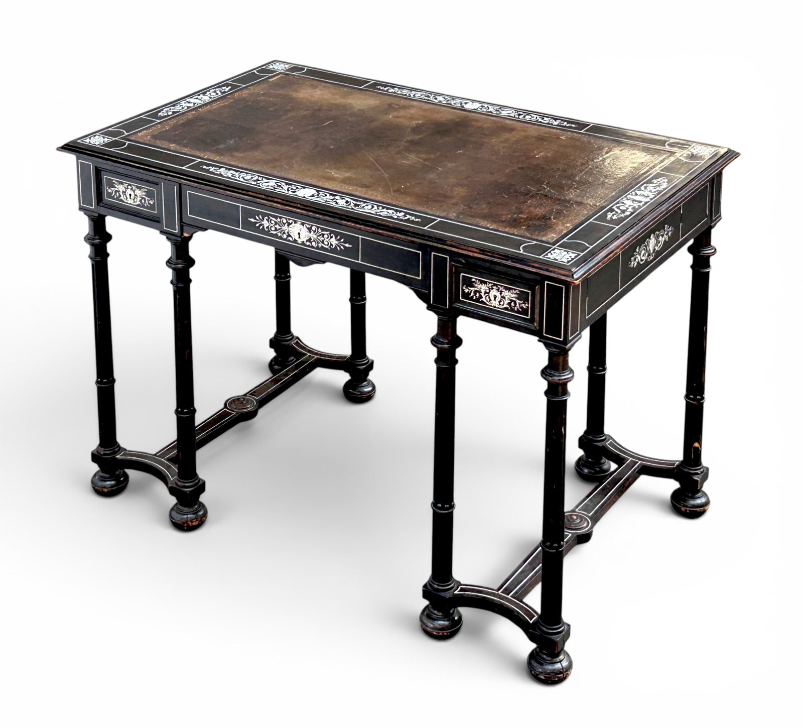 Outstanding Antique Italian Writing Desk.: This Ferdinand Pogliani desk has ebonised wood with mother of pearl and other inlay. The writing surface has a leather top, one center drawer, turned legs, and a stretcher base. The leather has some