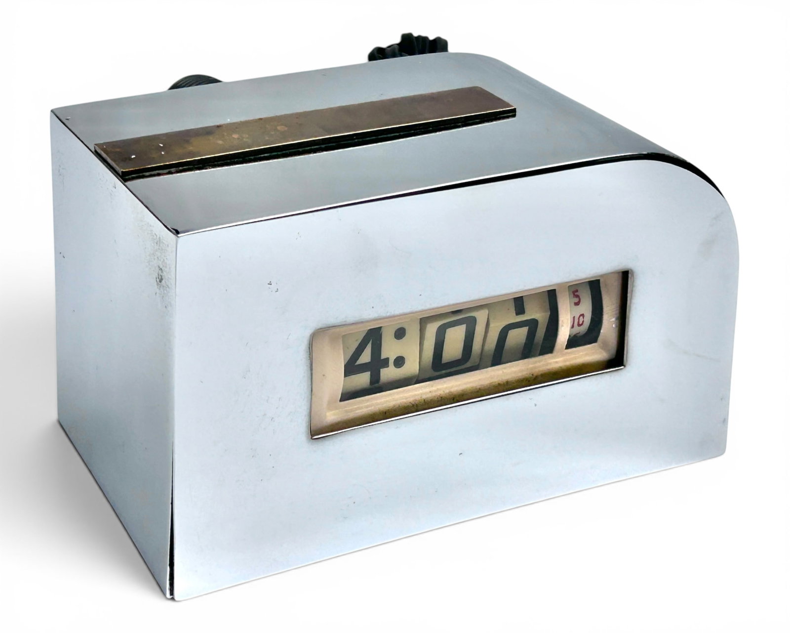 Zephyr Style Chrome Art Deco Flip Desk Clock.: The vintage clock appears to be unbranded. It features a chrome body with a brass strip on the top. It measures 3 3/4" tall, 5 7/8" wide, and 3 1/2" deep. It doesn't seem to work. There are a few scra