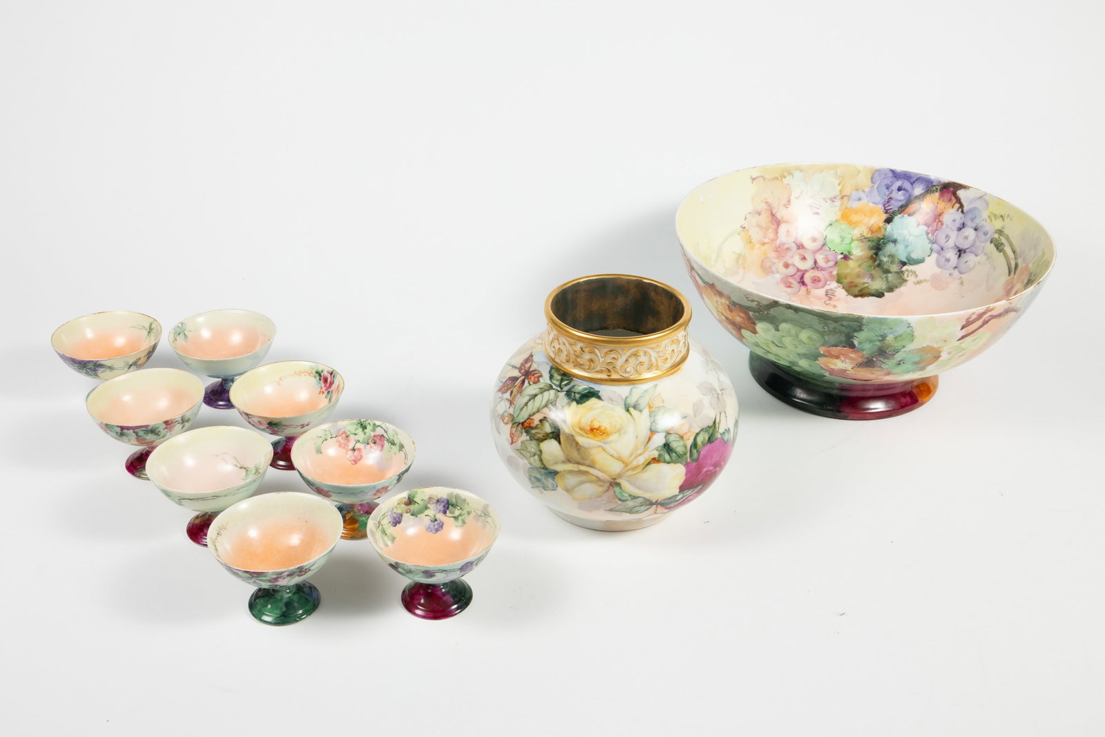 Lot: JPL Limoges Painted Porcelain, Austrian Cups.: The large bowl and squat vase are by Jean Pouyat Limoges. The set of 8 dessert cups or sherbets is Austrian (a few are marked). One of these cups has a small chip, but overall, the lot looks to be in 